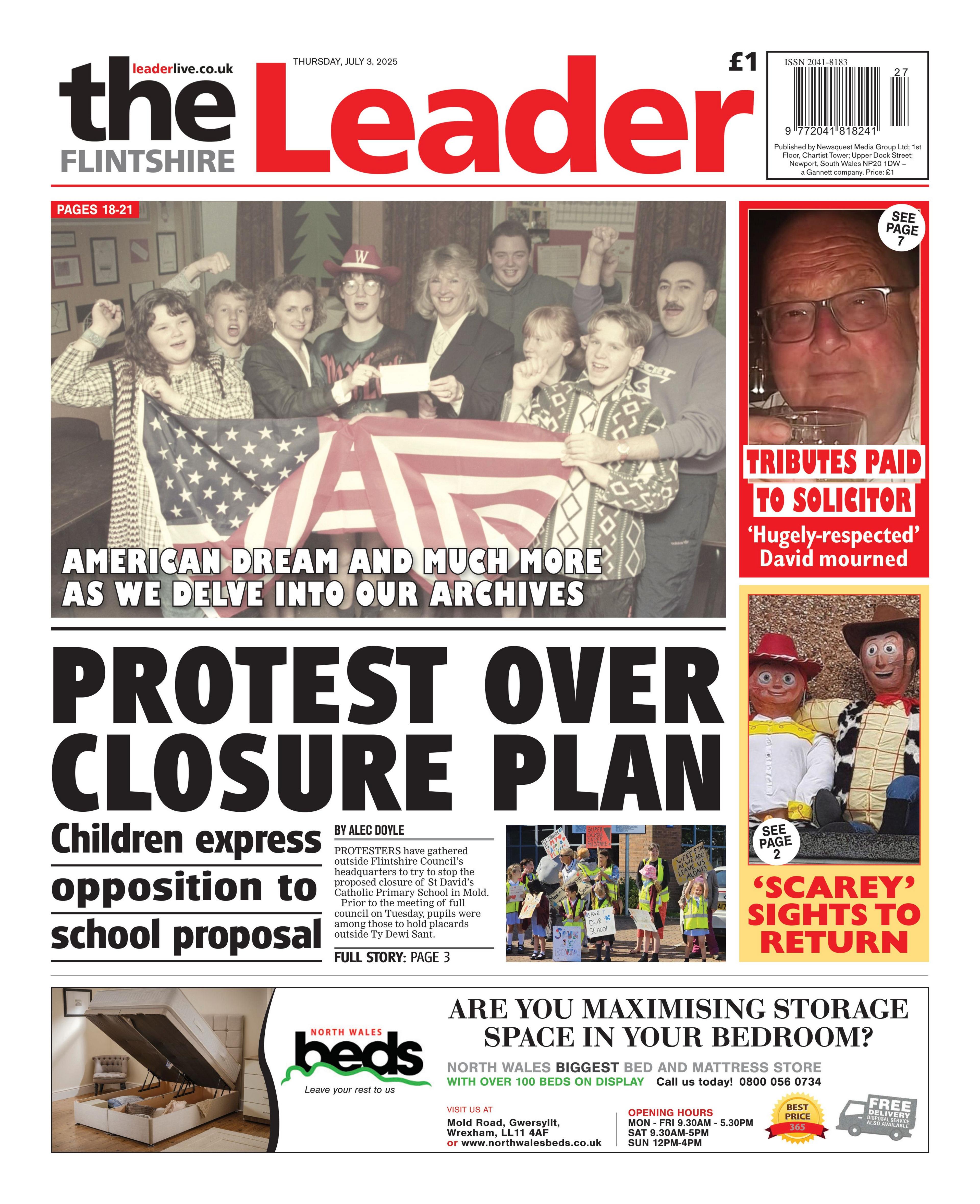 Front page of The Flintshire Leader. Main headlines reads: Protest over closure plan; Children express opposition to school proposal. Above that is an image of people holding an American flag with the headline "American dream and much more as we delve into our archives". Next to that is a picture of a man with the headline "tributes paid to solicitor" and under that is a picture of two toy puppet figures with the headline "scarey" sights to return.