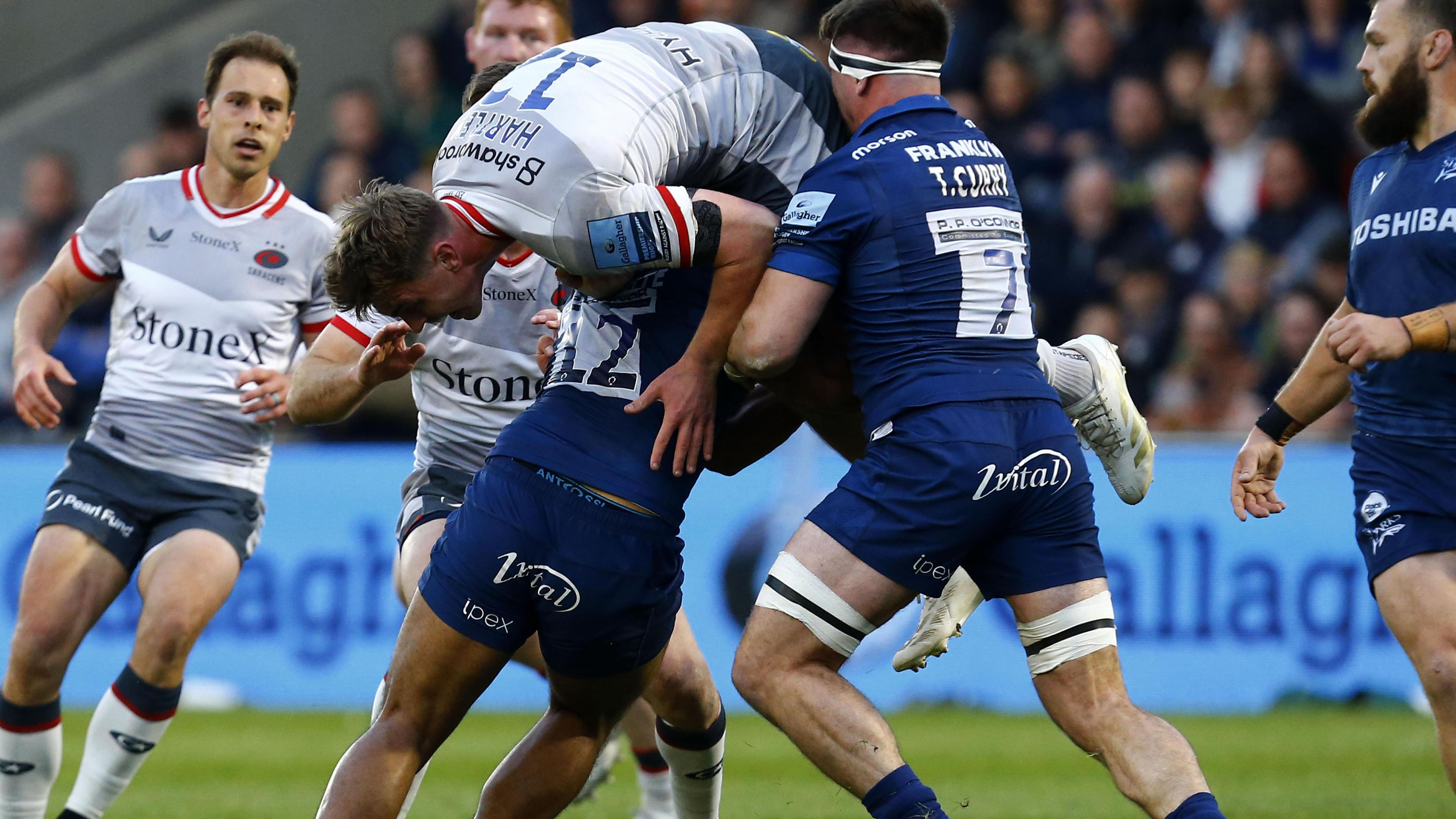 Rekeiti Ma'sai-White tackles Saracens' Olly Hartley