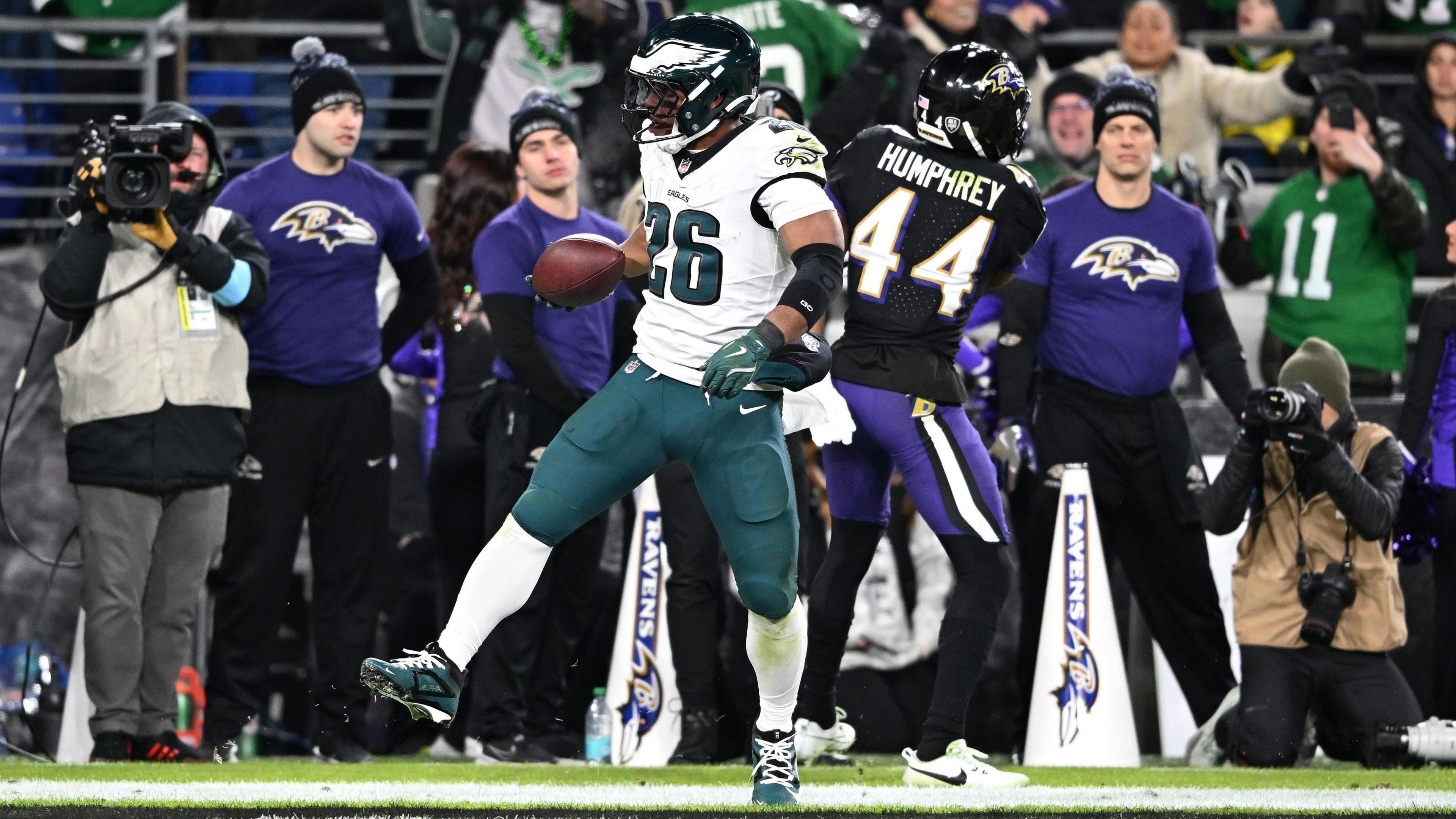 Philadelphia Eagles running back Saquon Barkley gets into the end zone for a touchdown against the Baltimore Ravens