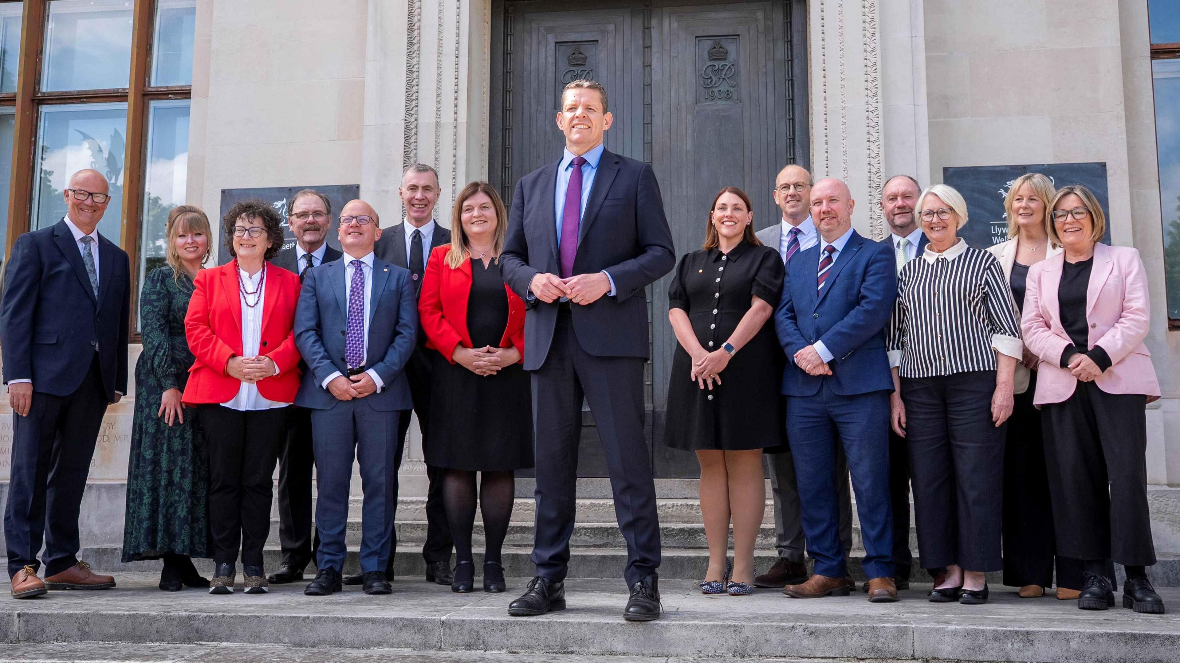 Rhun ap Iorwerth in the middle flanked by cabinet ministers