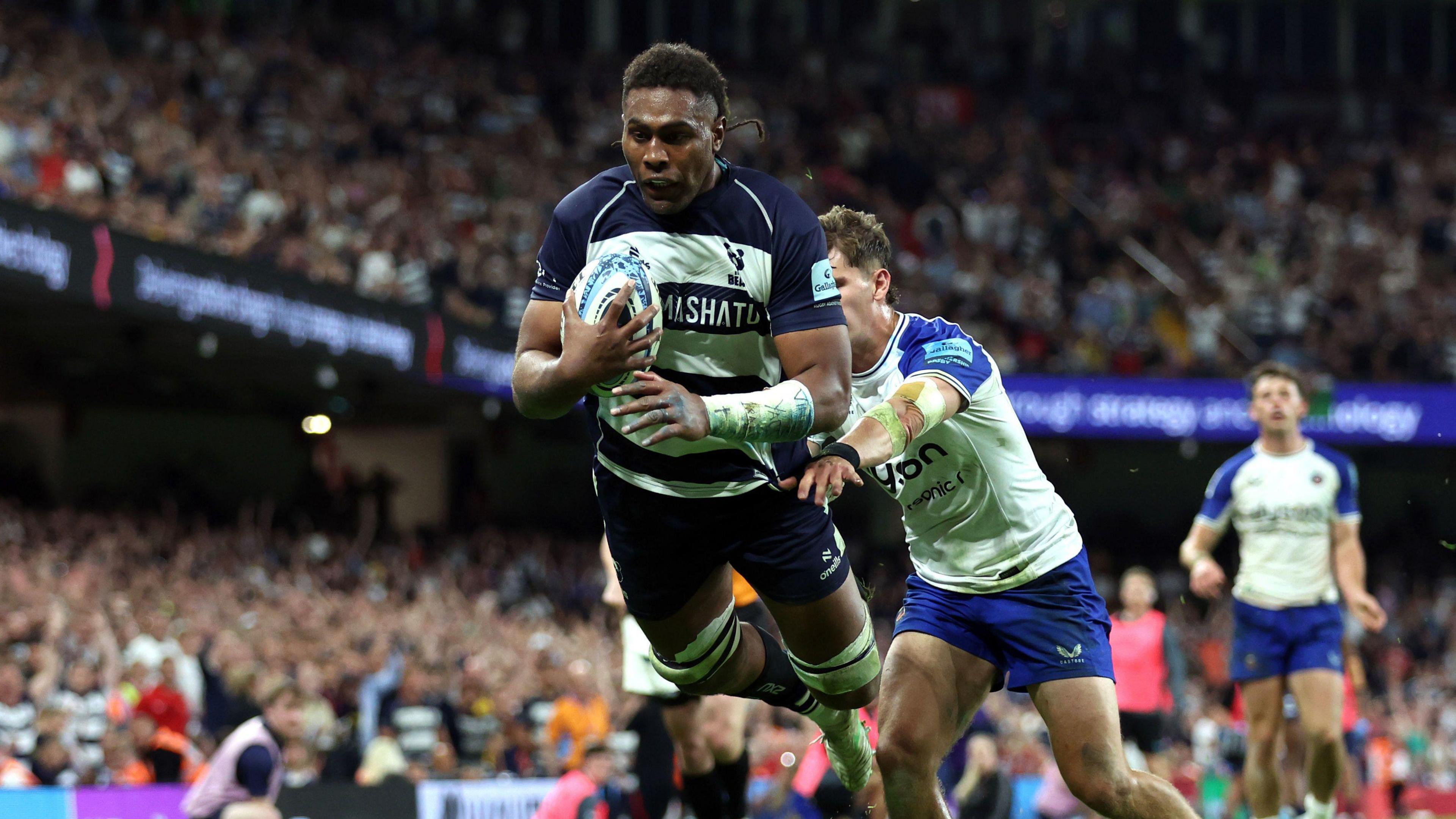 Viliame Mata dives over the tryline to score
