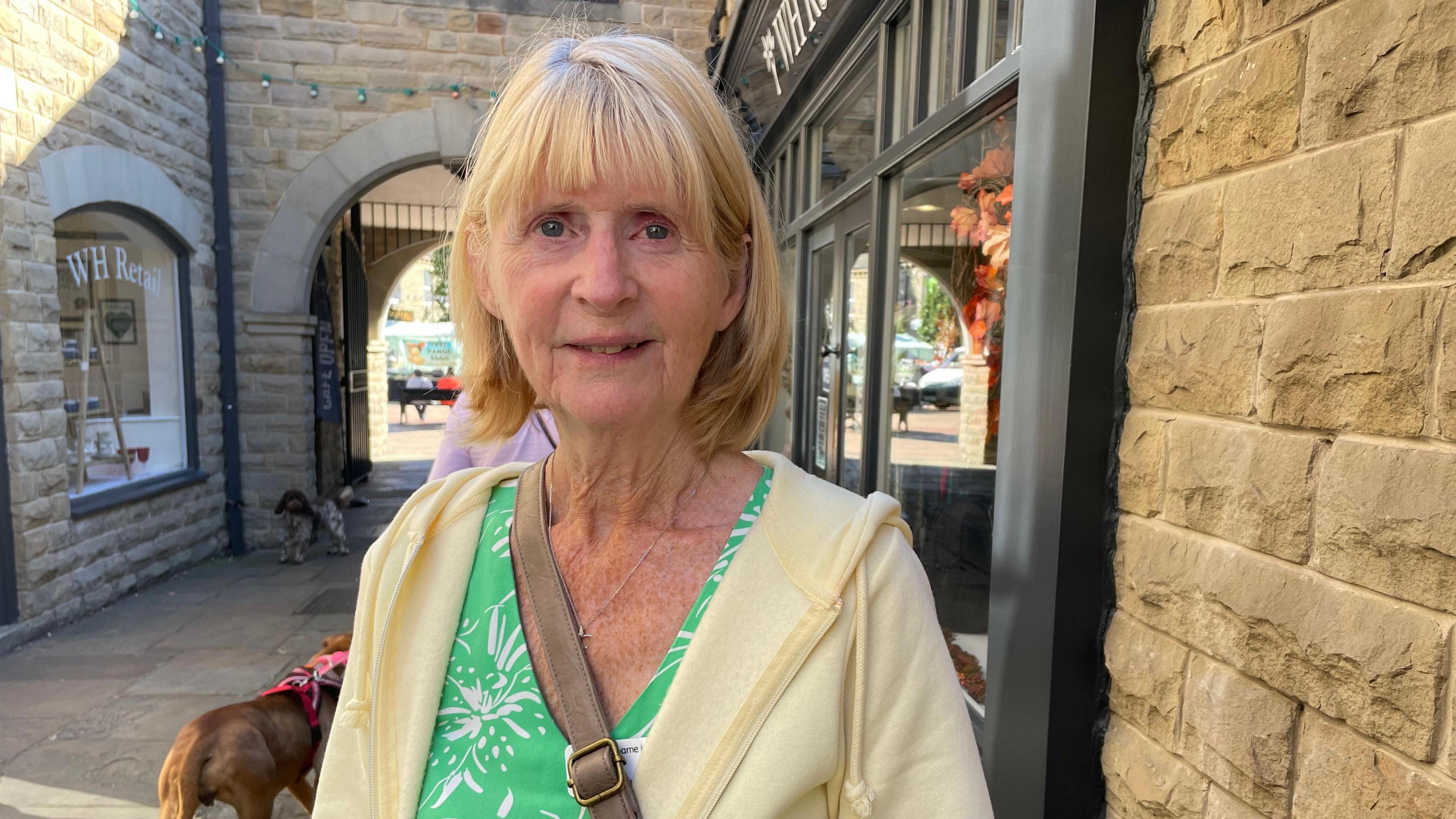 Carol Roberts, standing outside the banking hub