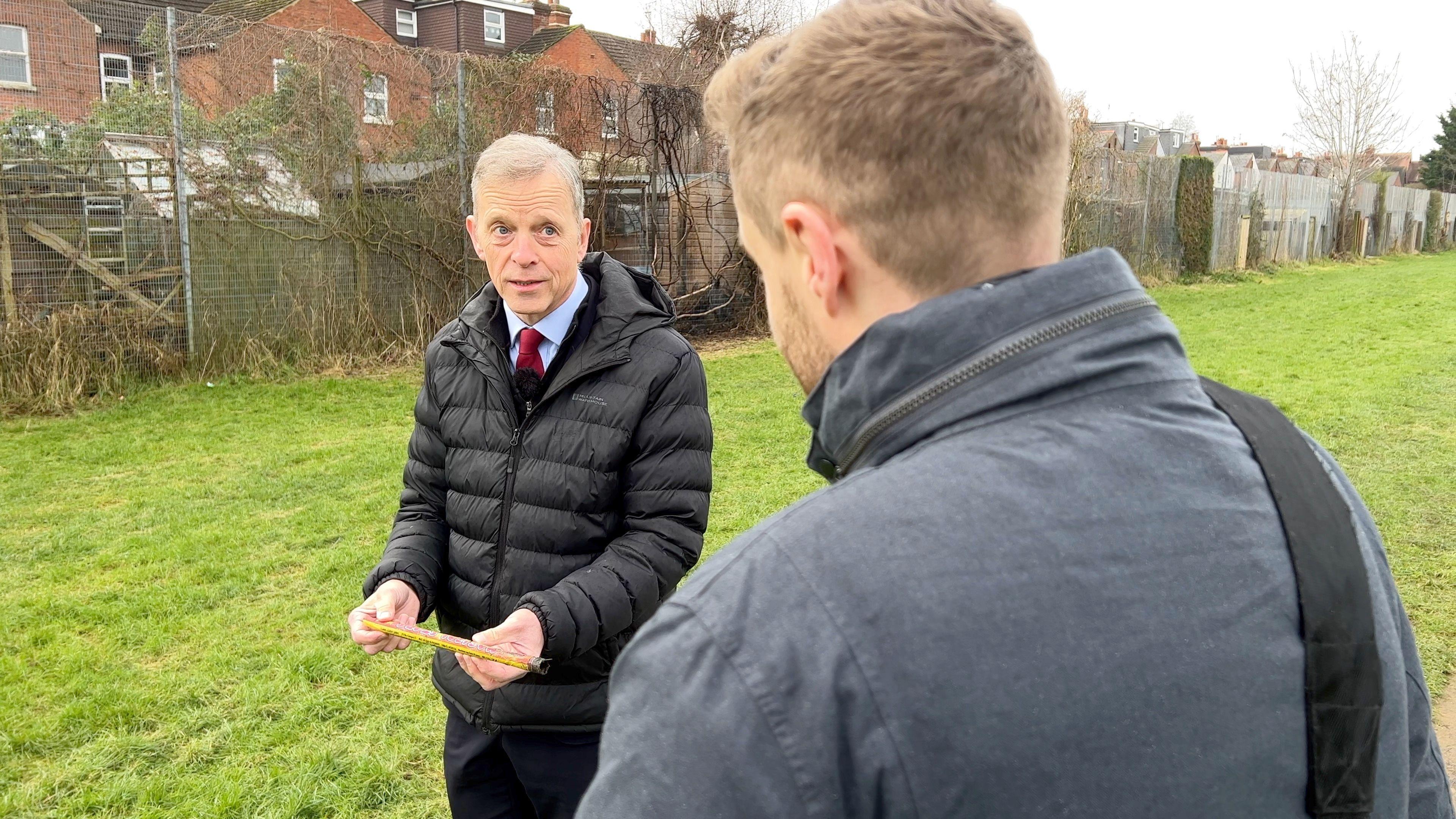 MP Matt Rodda holds a spent firework found in the park.