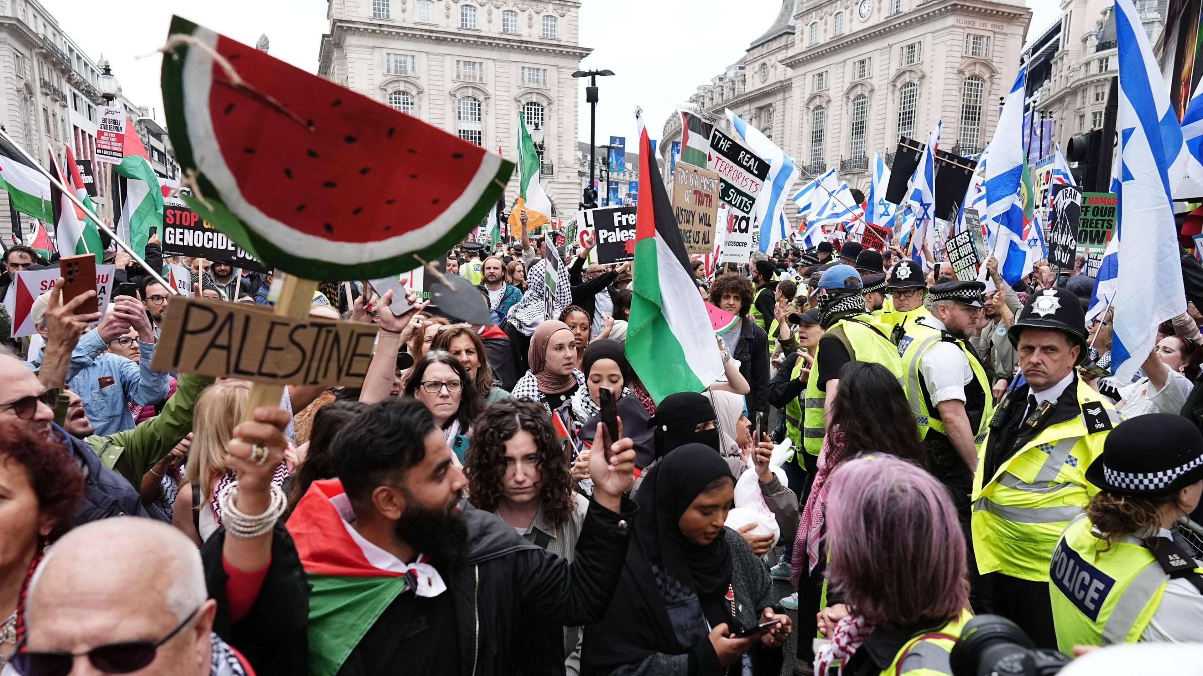 An image showing a counter protest at Piccadilly Circus being met by Pro-Palestinian protesters