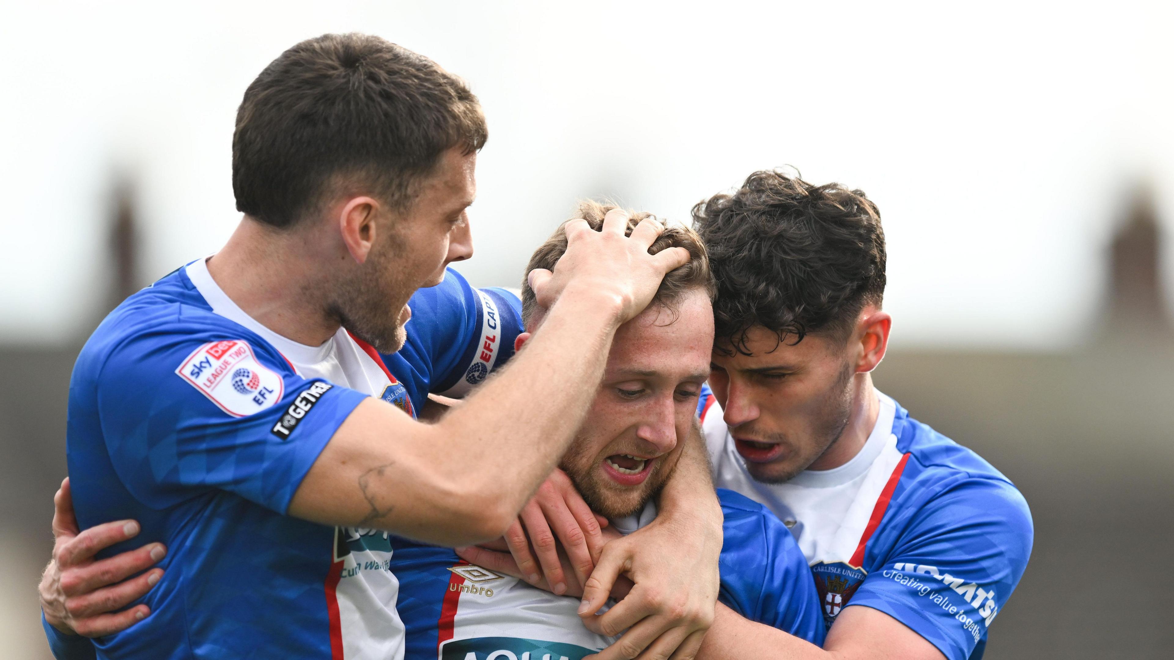 Captain Sam Lavelle (left) congratulates Stephen Wearne (centre) on scoring against Bromley