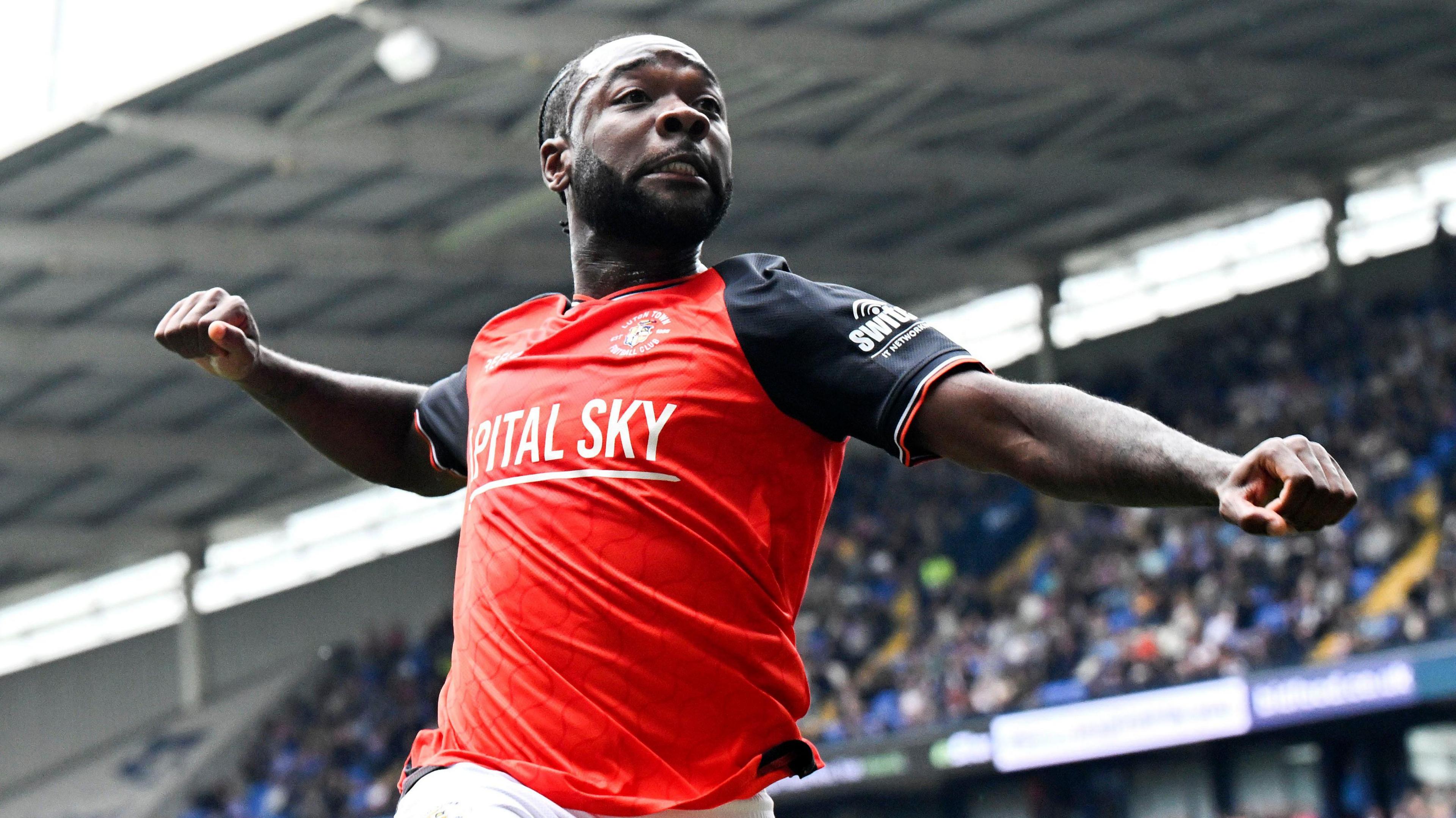 Shayden Morris, with right fist clenched, celebrates his winning goal for Luton at Bolton 