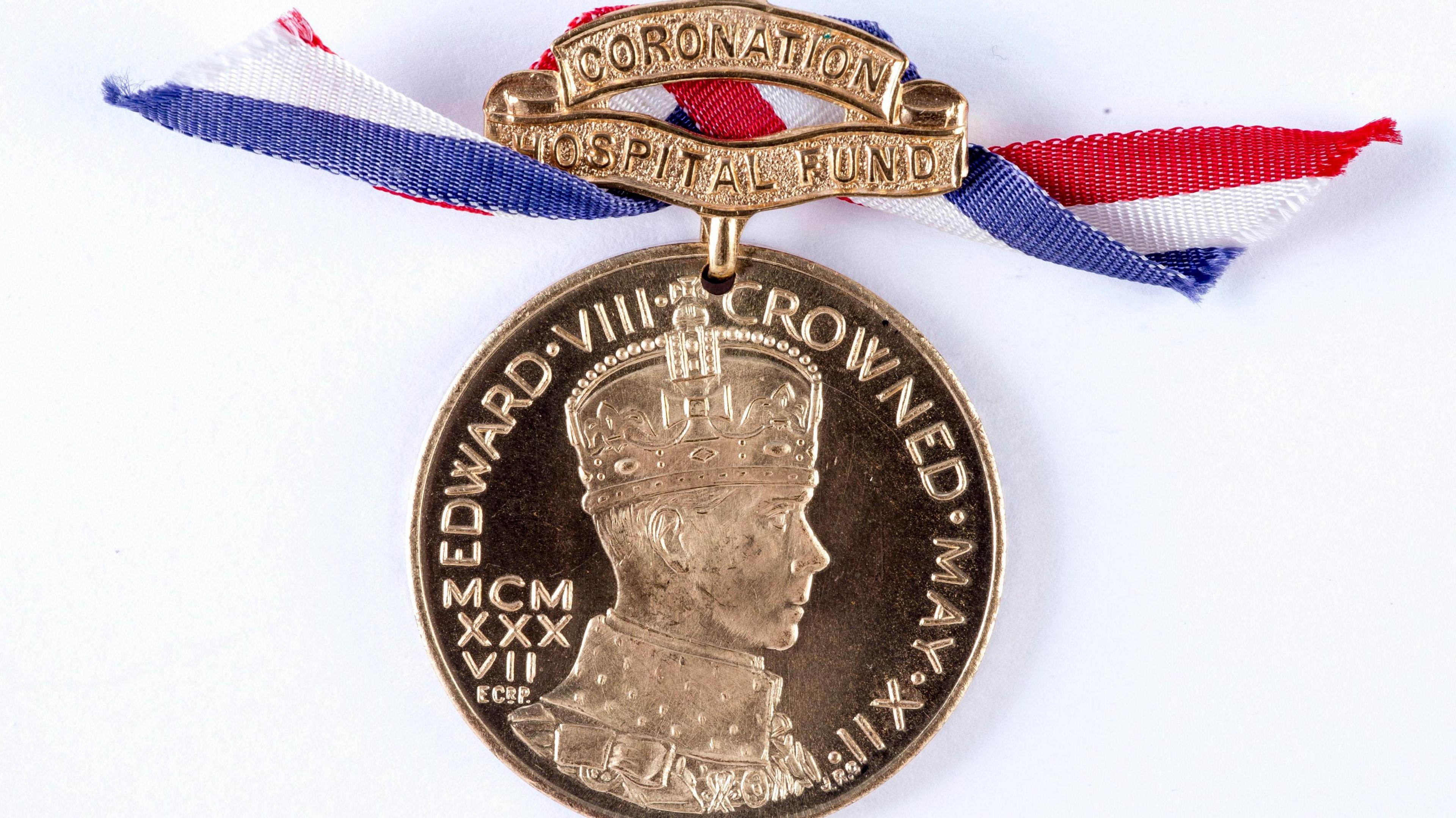 The Coronation Hospital Fund medal with a profile bust of Edward VIII, and red, white and blue ribbon.