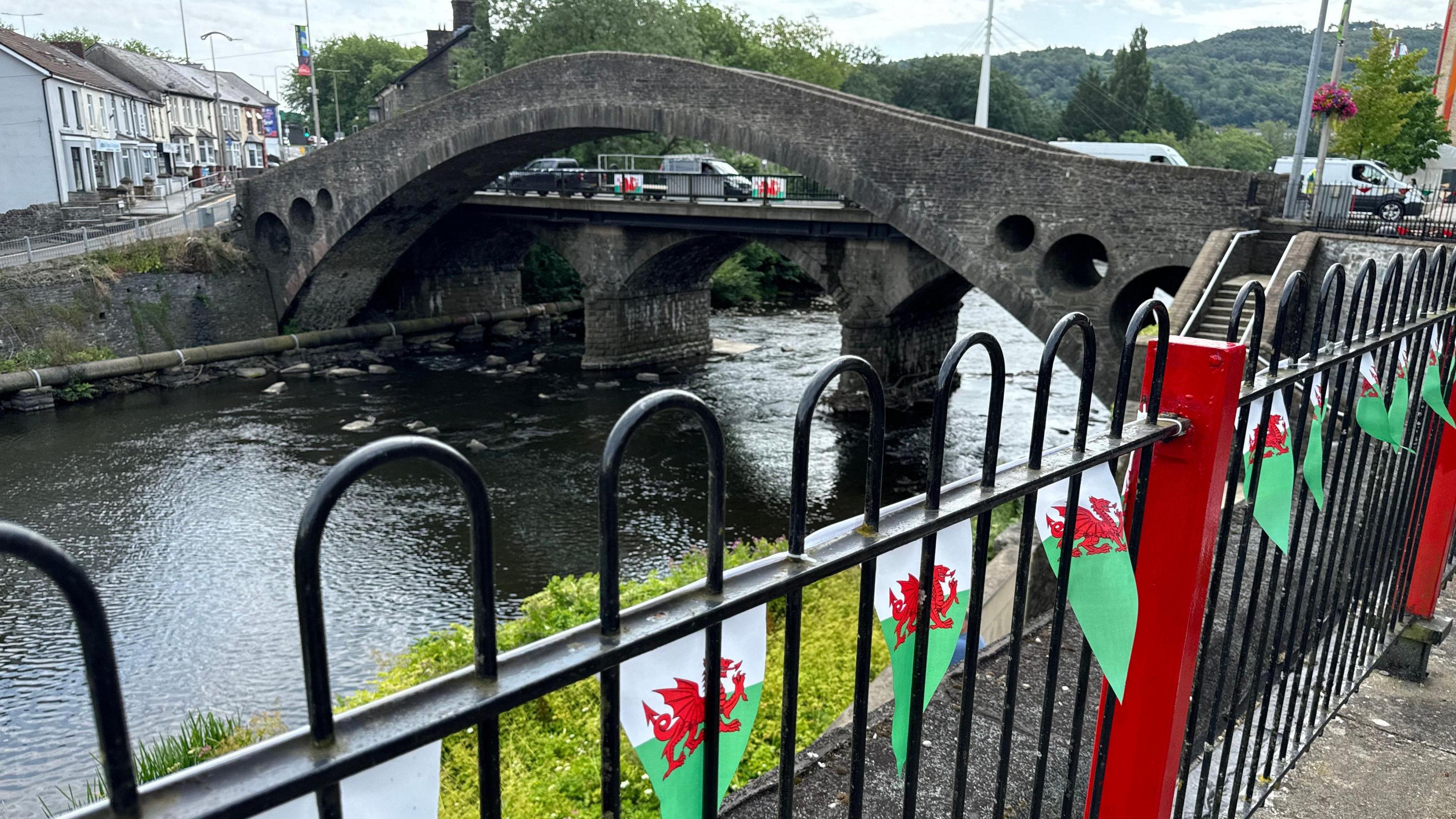 A bridge in Pontypridd adorned with Welsh flags.