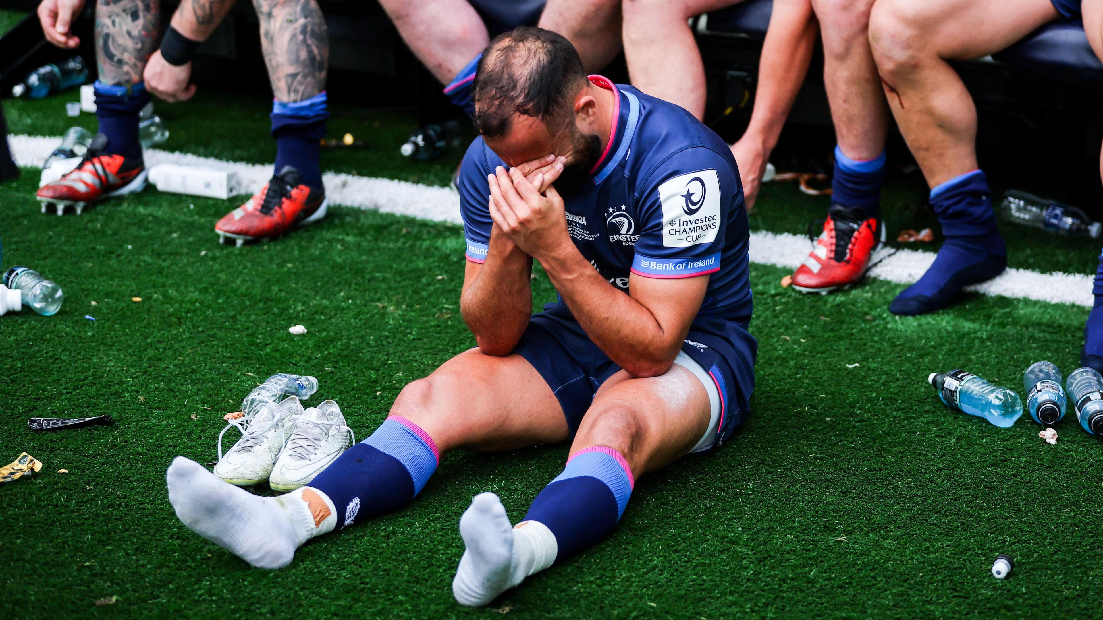 Jamison Gibson-Park sits devastated after the final whistle