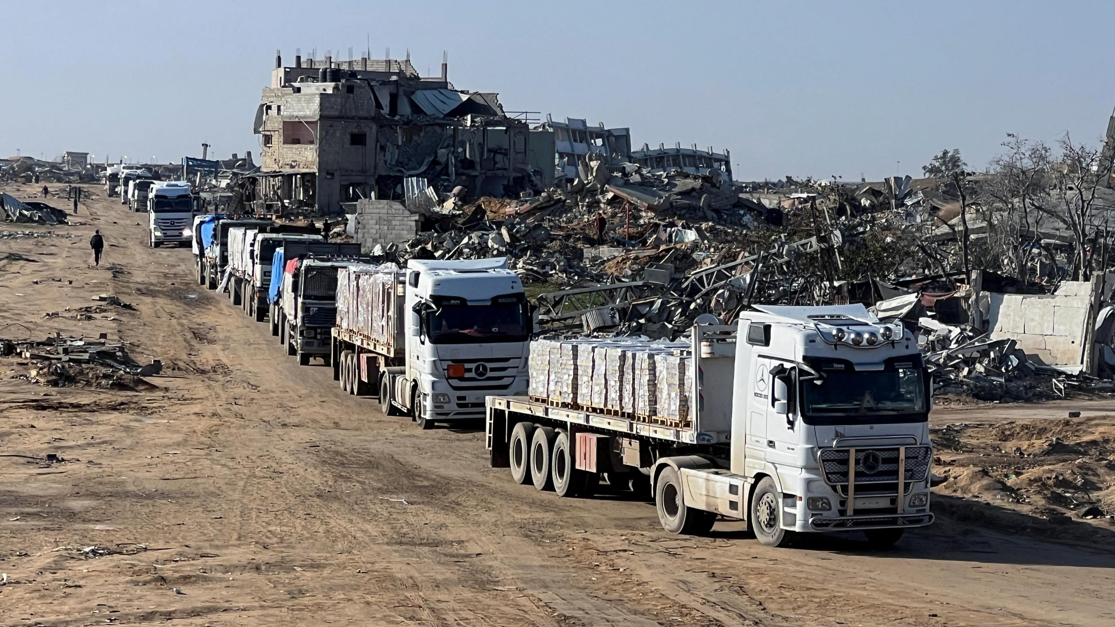 Aid lorries drive through Rafah, in southern Gaza, during a ceasefire between Israel and Hamas (13 February 2025)