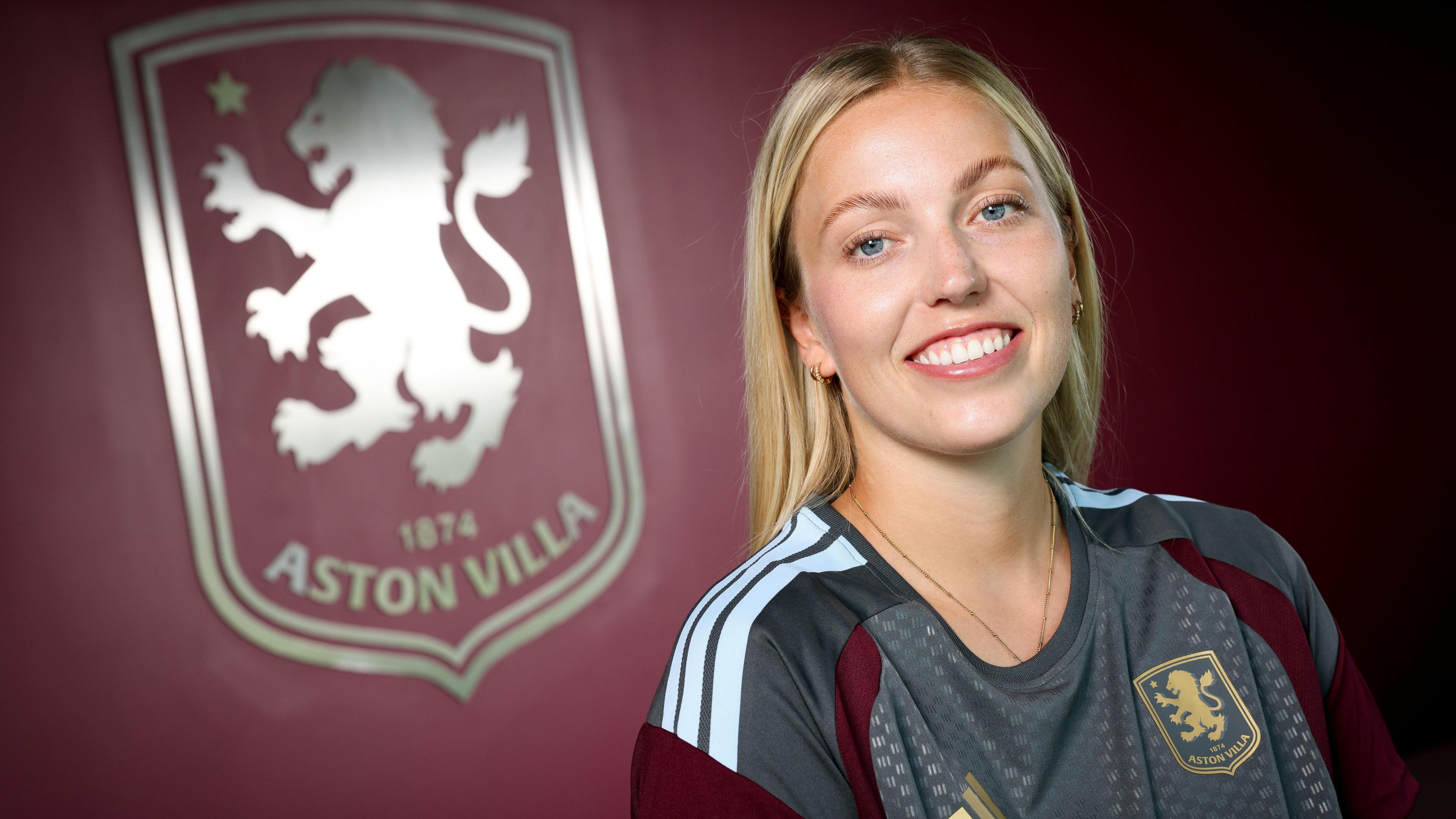 Emily Ramsey in front of a claret background and Aston Villa badge
