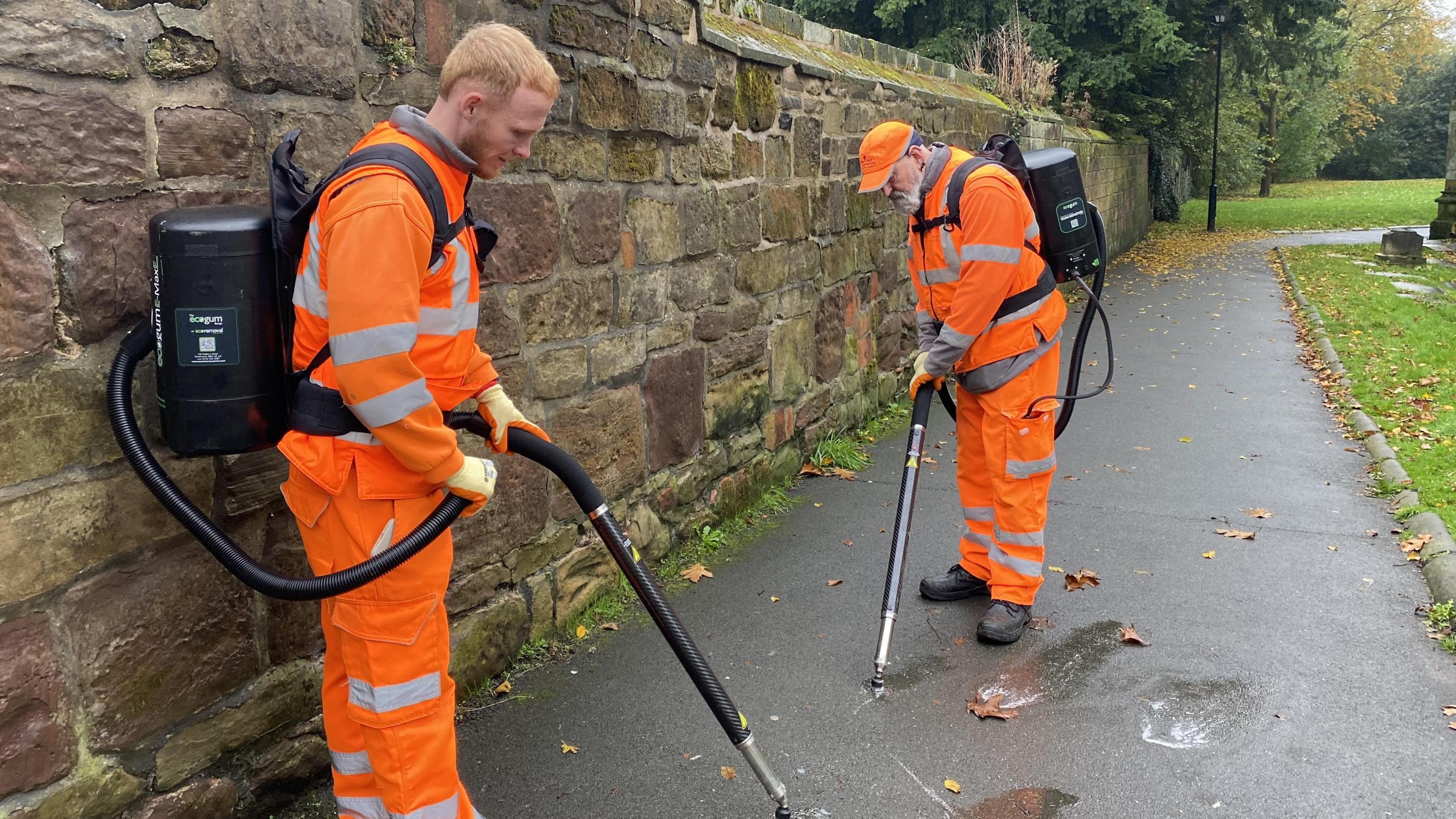 Lewis Freeman (left) using the equipment in a churchyard in Ashby-de-la-Zouch