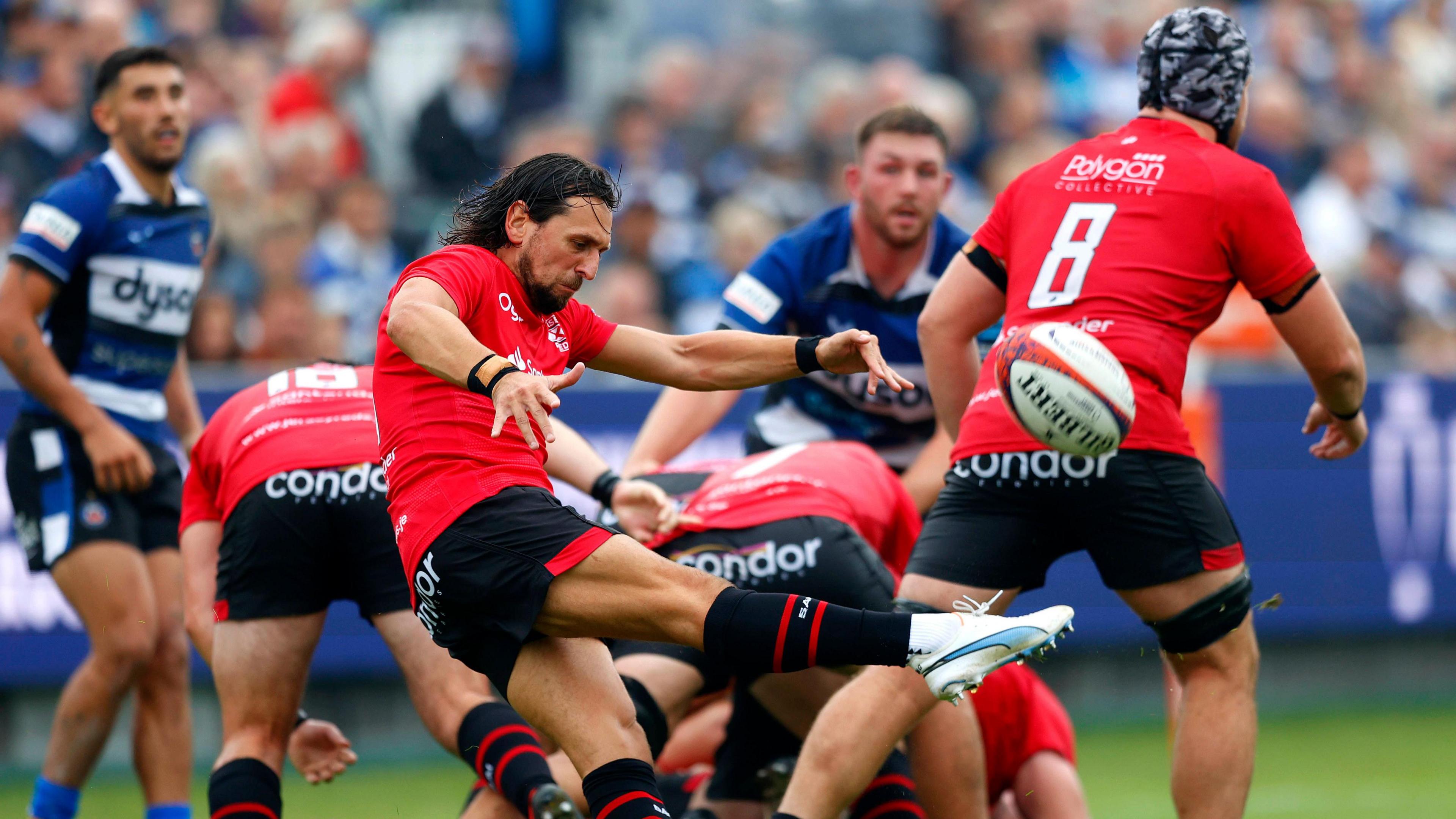 James Mitchell kicks the ball at Bath