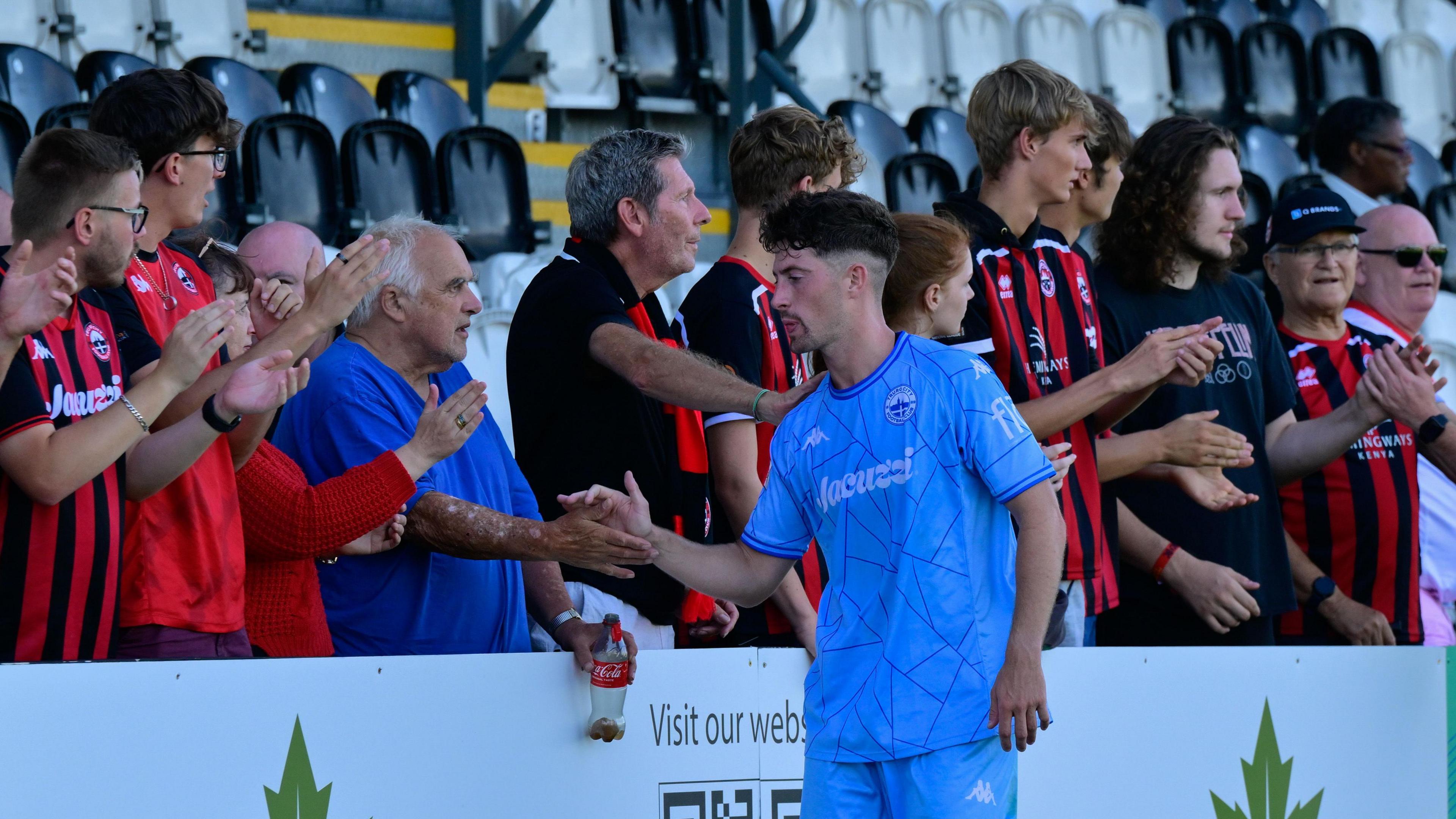 Dan Rooney shaking fans' hands after Boreham Wood defeat
