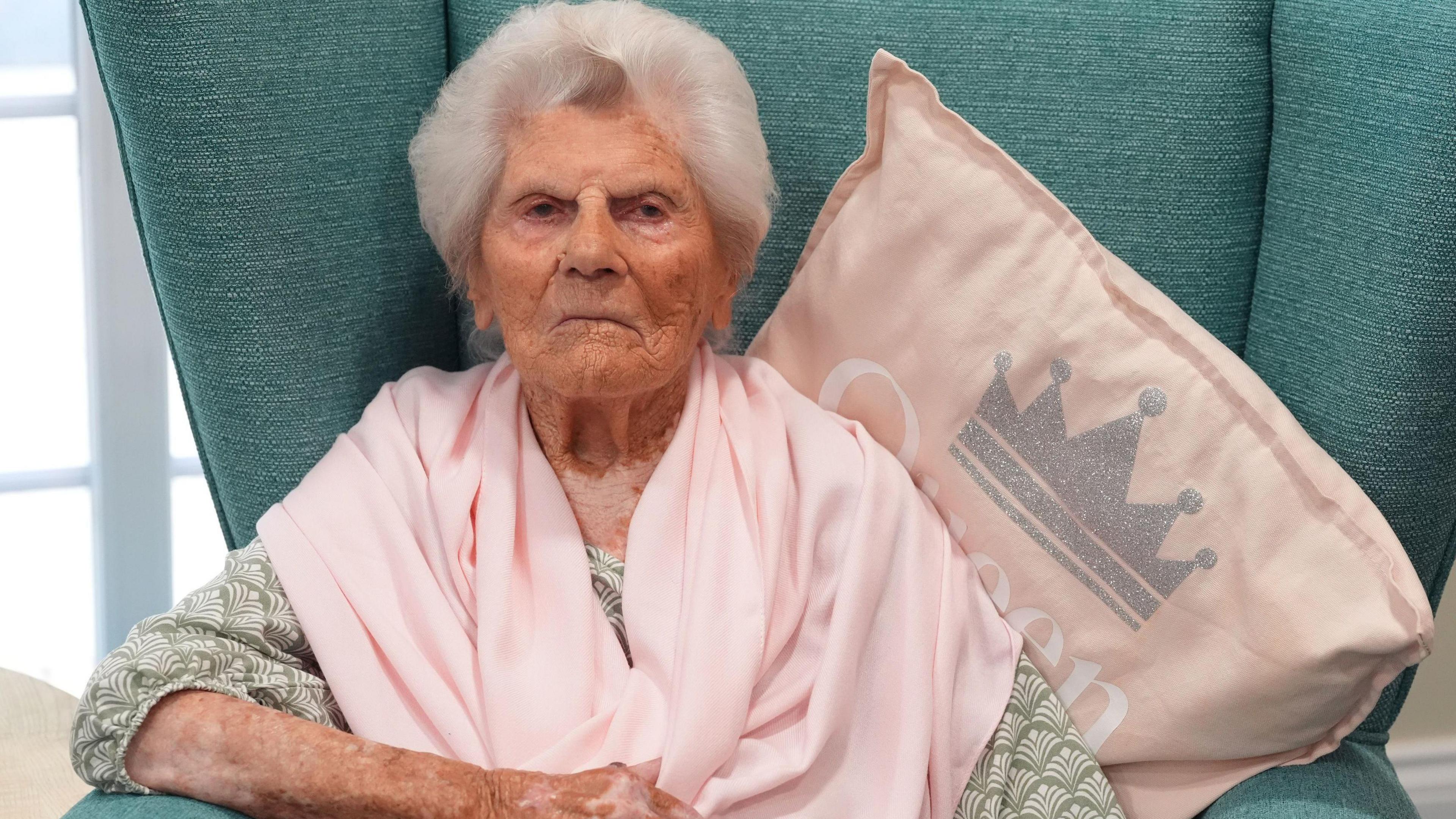 Ethel Caterham sitting in her chair at Hallmark Lakeview Care Home in Lightwater, Surrey.