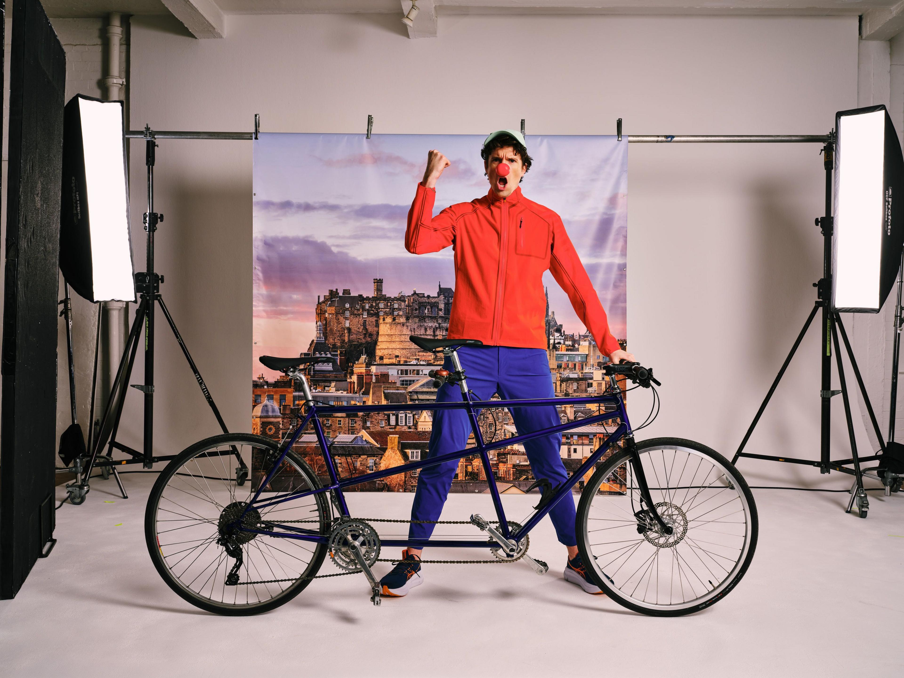 Greg James standing by tandem bike 