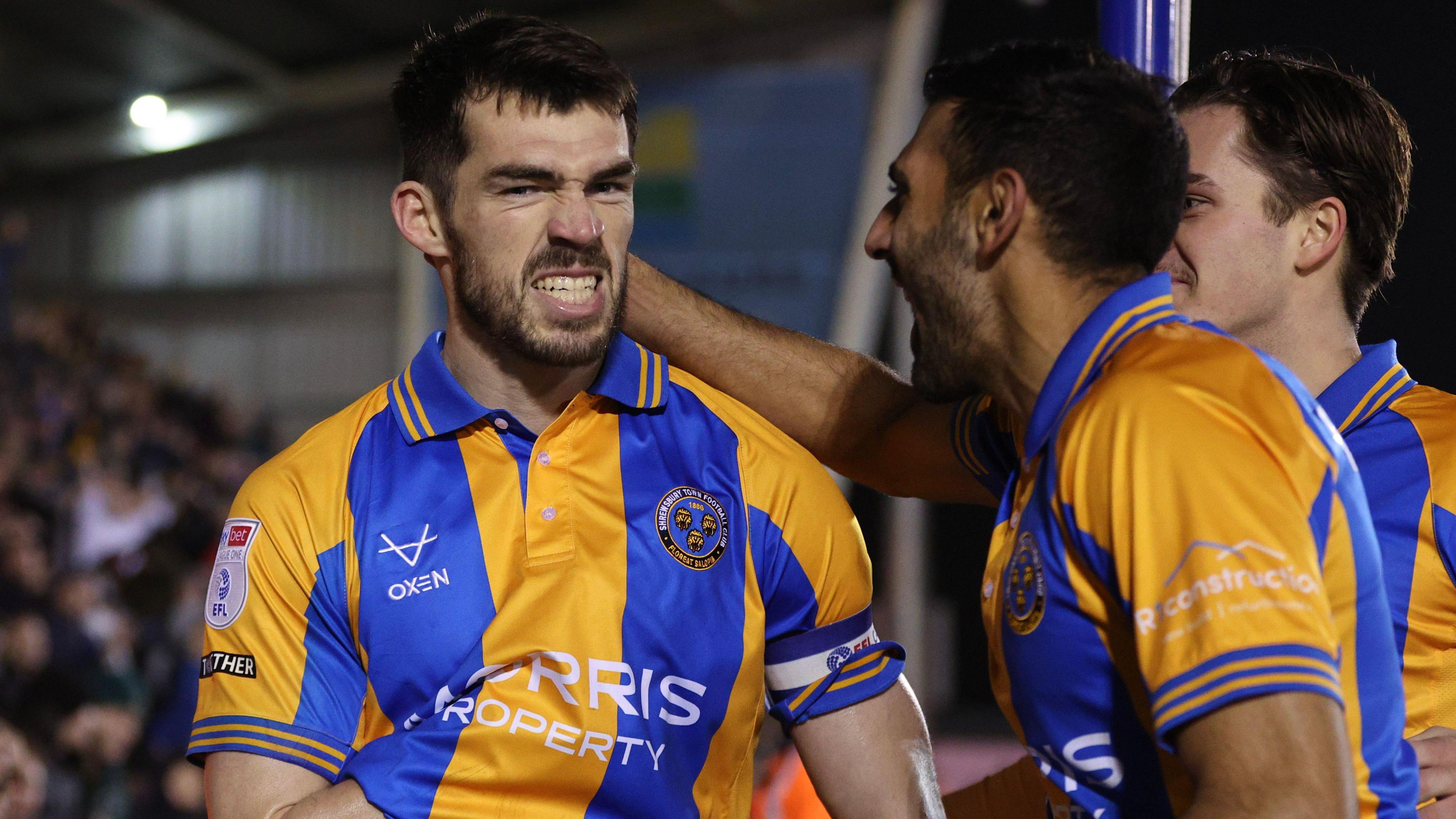 John Marquis (left) celebrates his goal for Shrewsbury Town against Wrexham