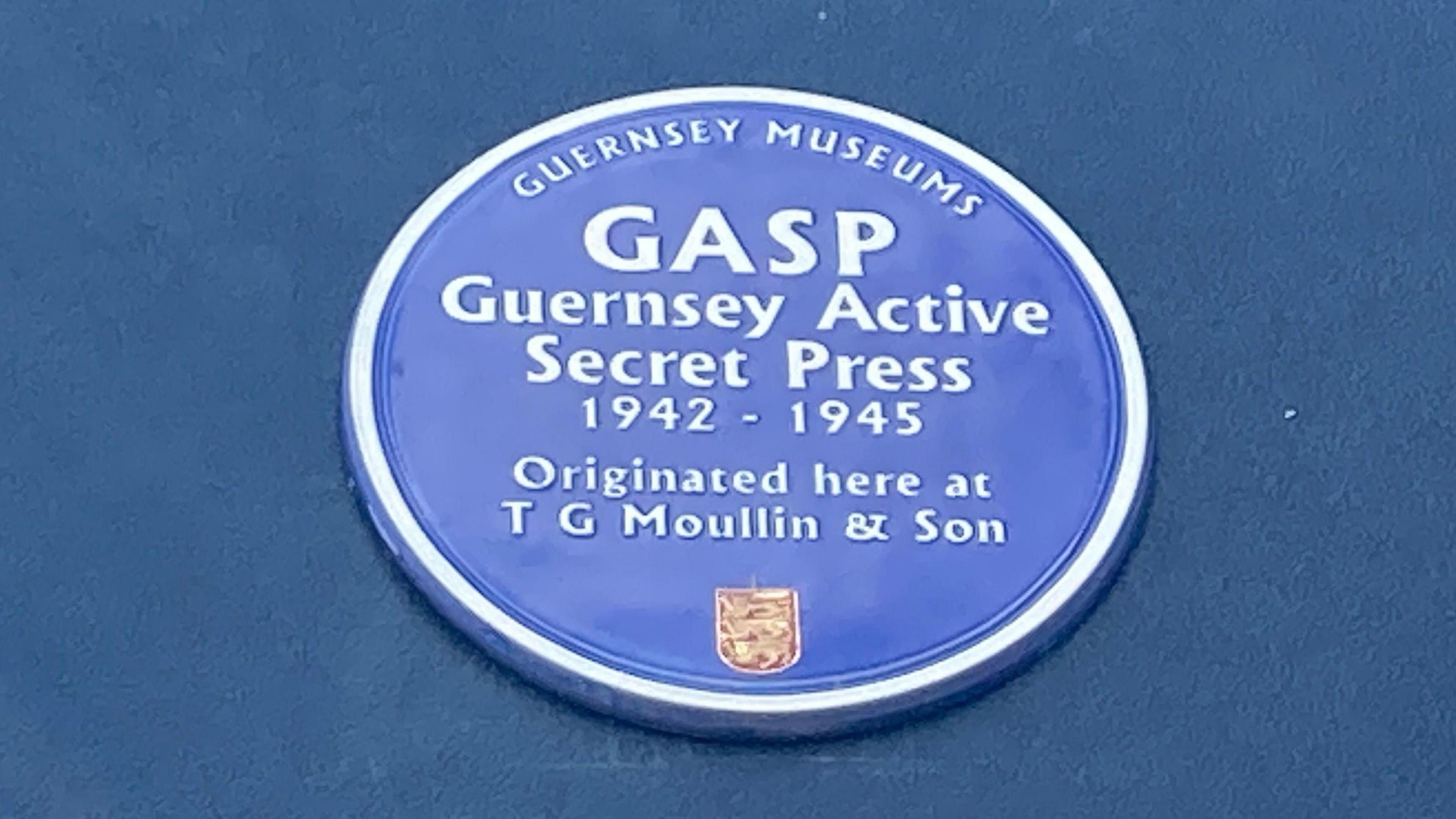 The blue plaque engraved with the words: GASP - Guernsey Active Secret Press 1942-1945. Originated here at T G Moullin & Son.