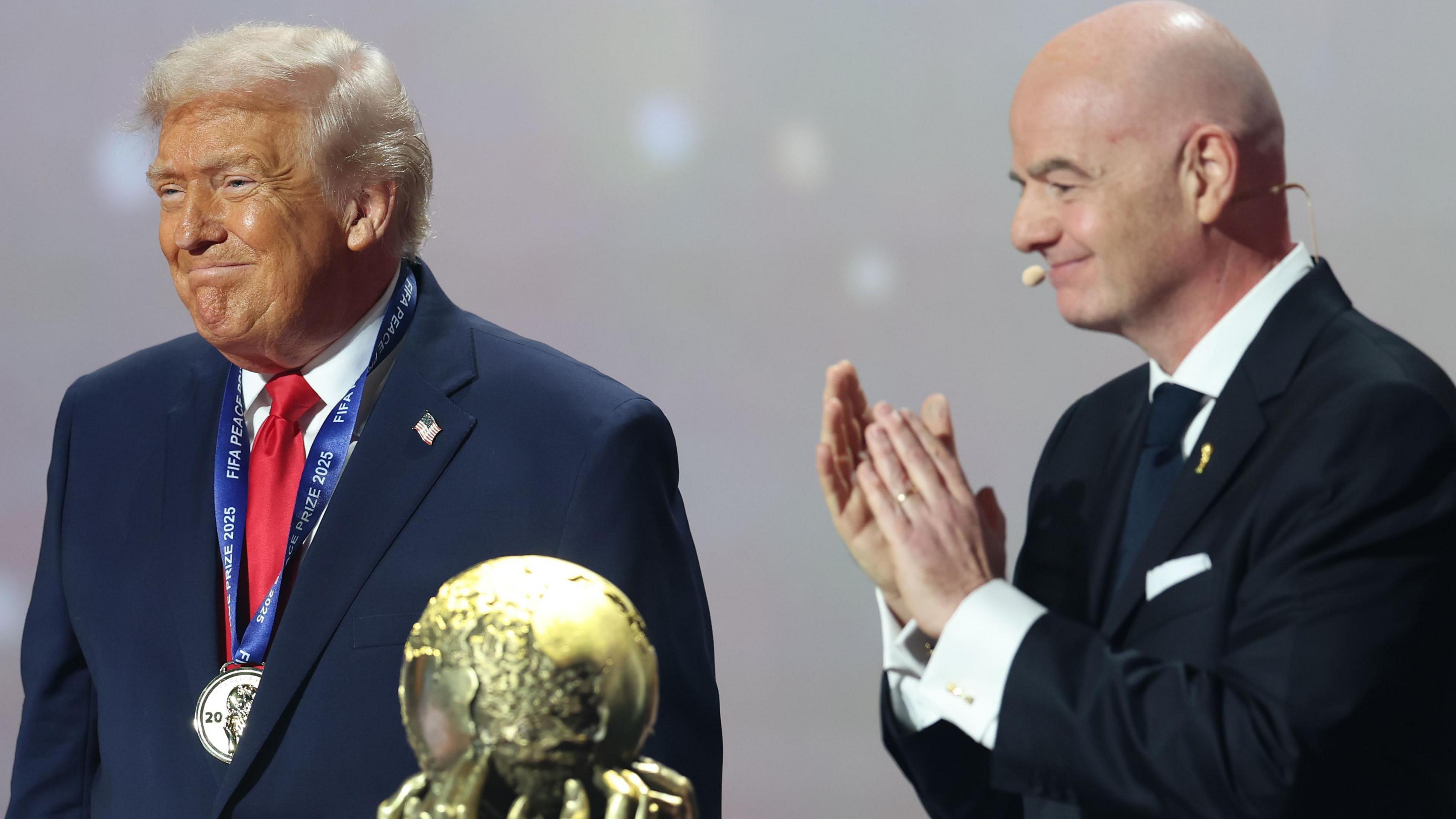 Donald Trump and Gianni Infantino with the Fifa Peace Prize trophy