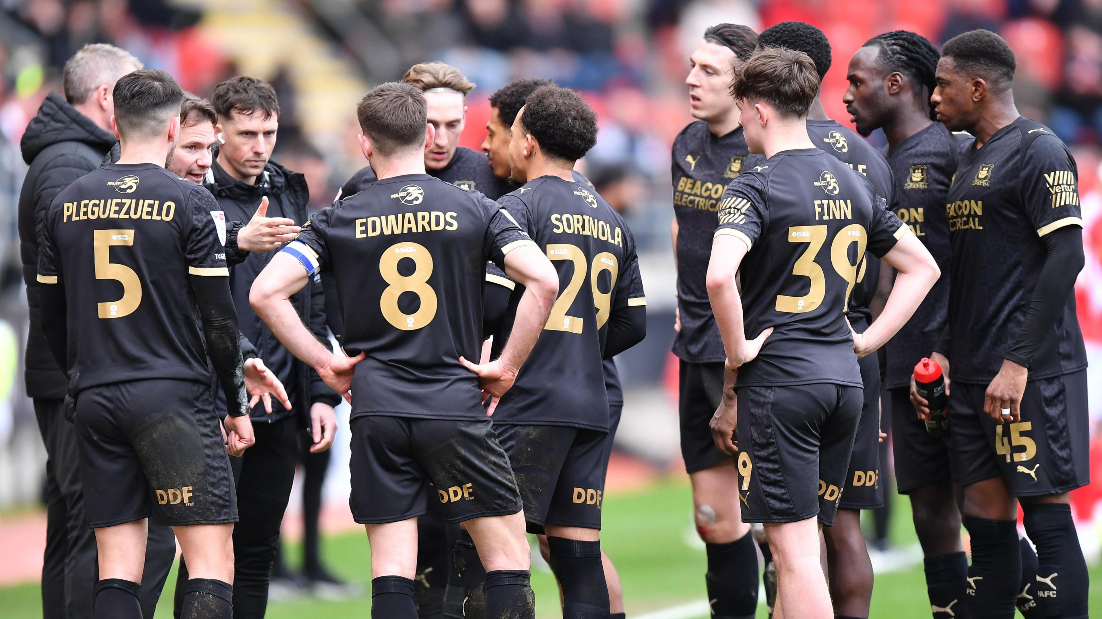 Tom Cleverley gives a team talk to his Plymouth Argyle squad