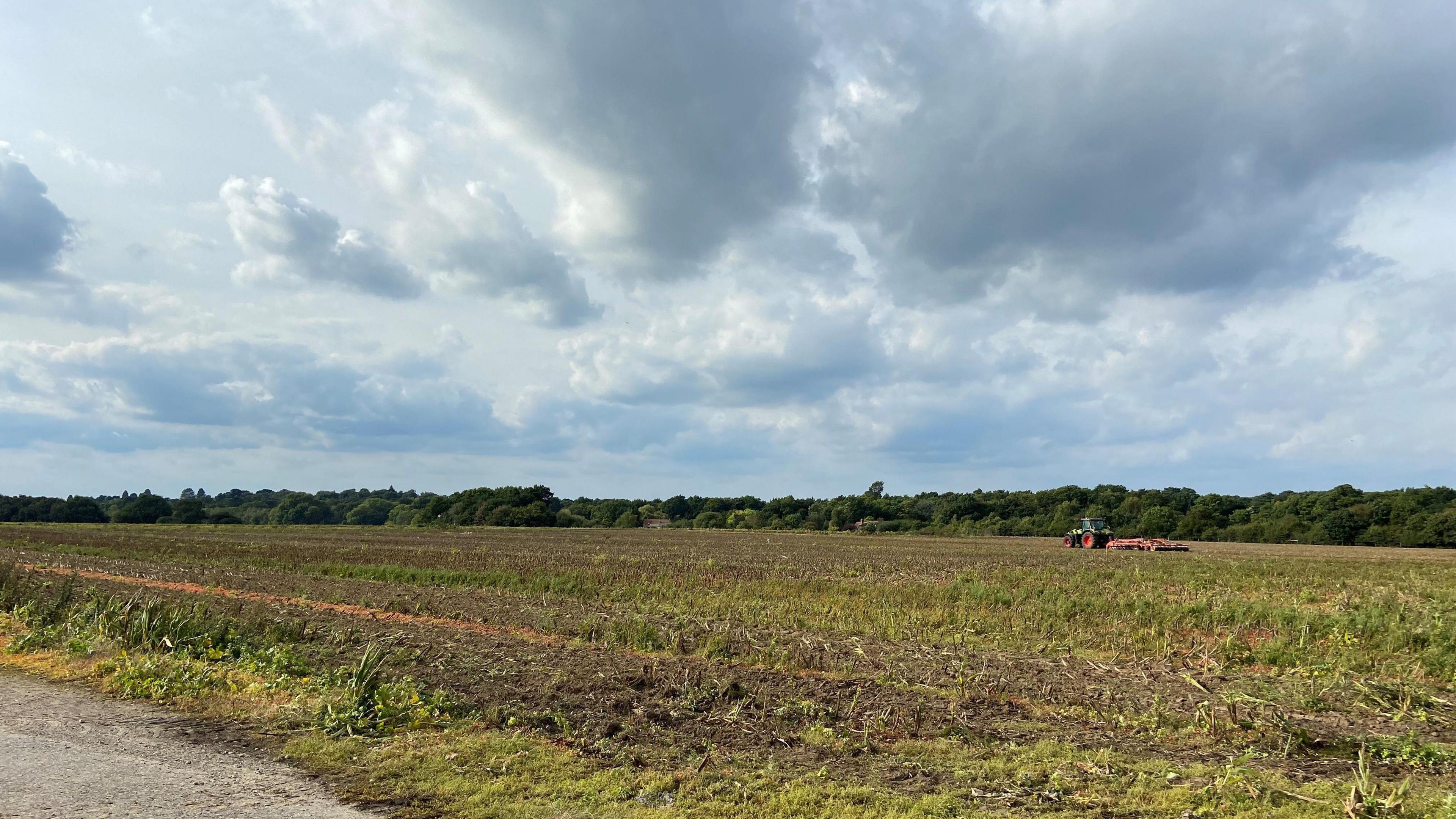 A tractor in a field on the former Wisley Airfield site