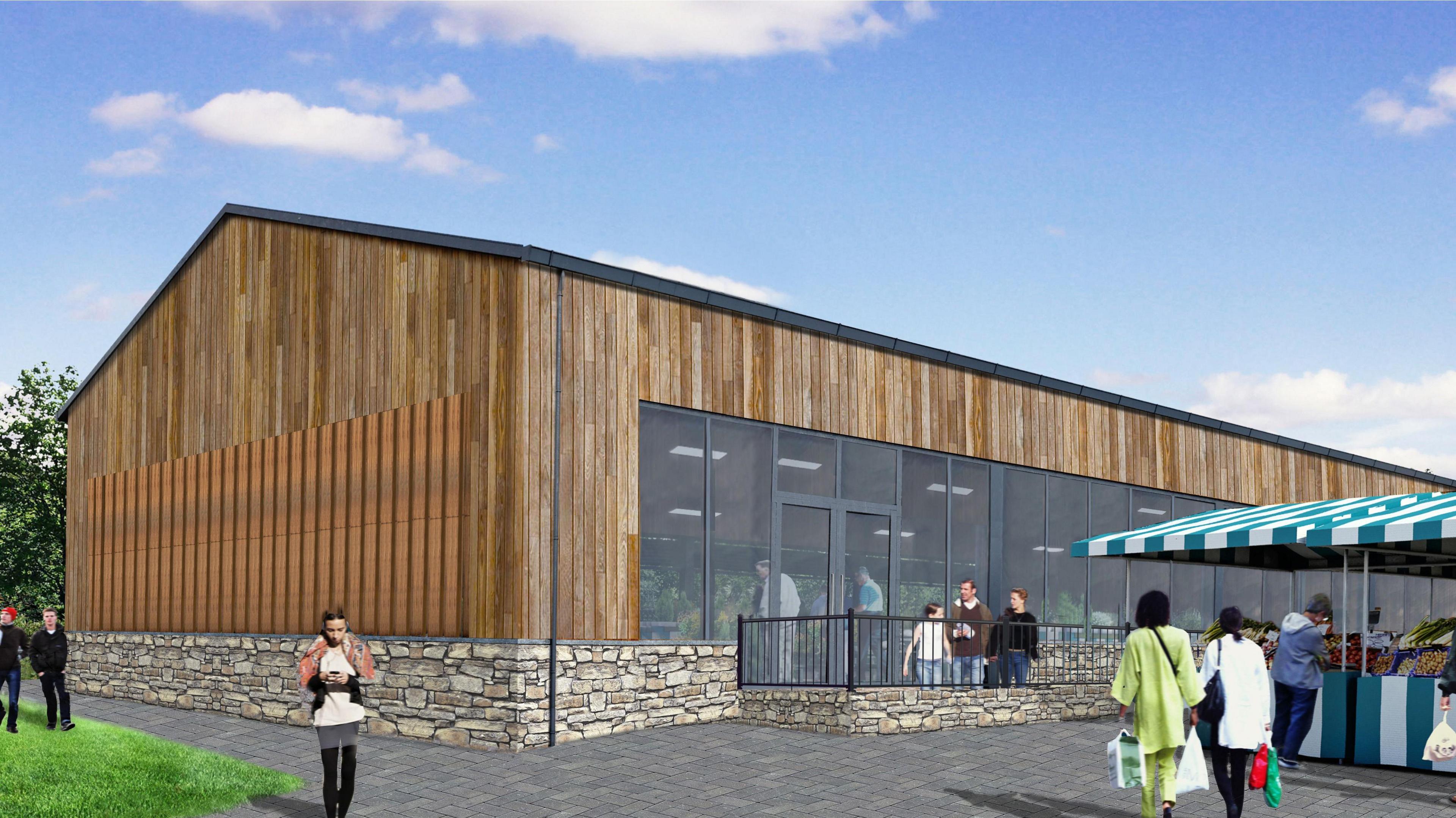 The artist's impression of the Hatherleigh Pannier Market building shows what it will look like.  The building has a stone base with a wooden and glass structure.
