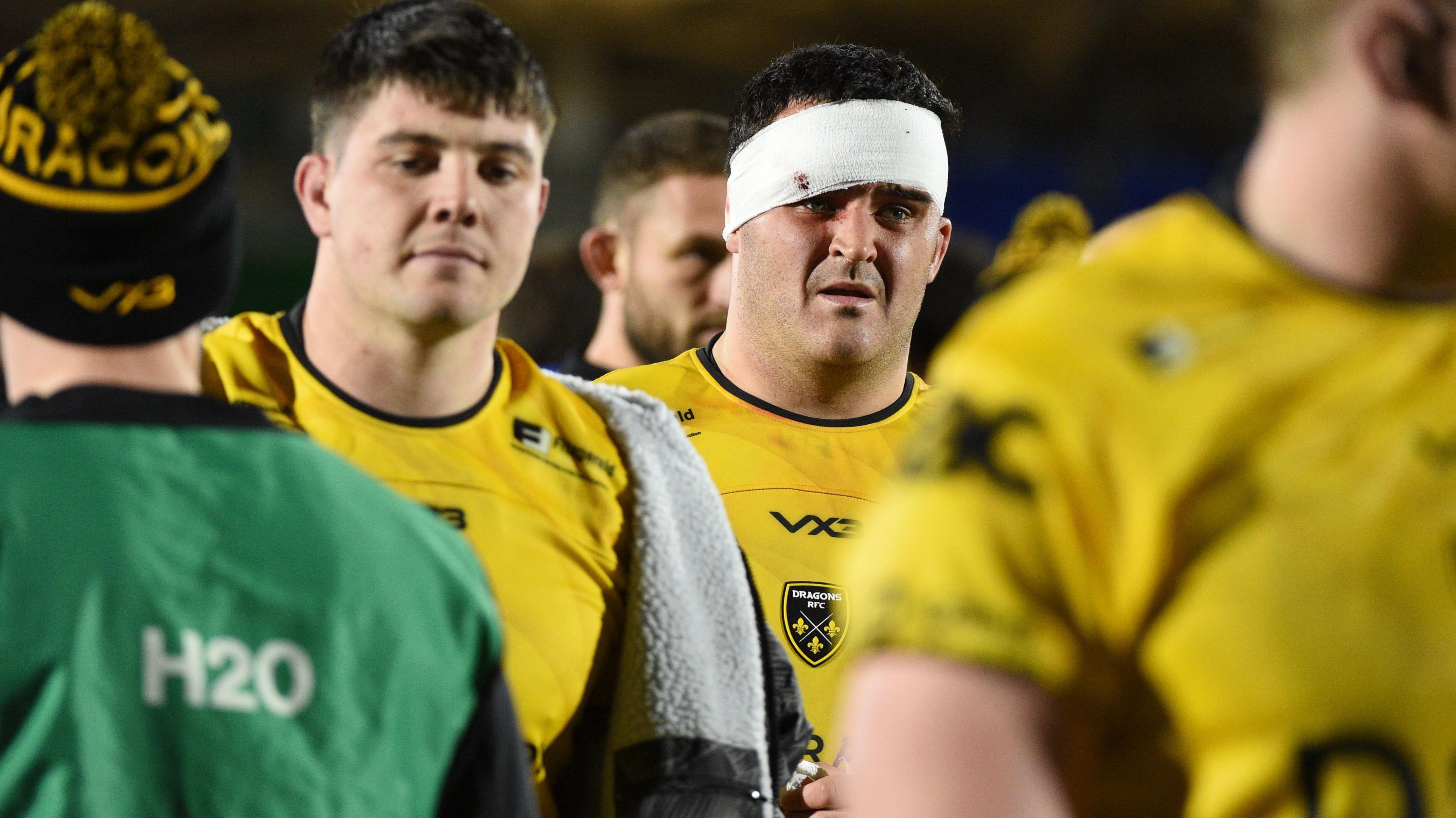 Chris Coleman leaves the pitch after Dragons' 49-0 defeat at Glasgow