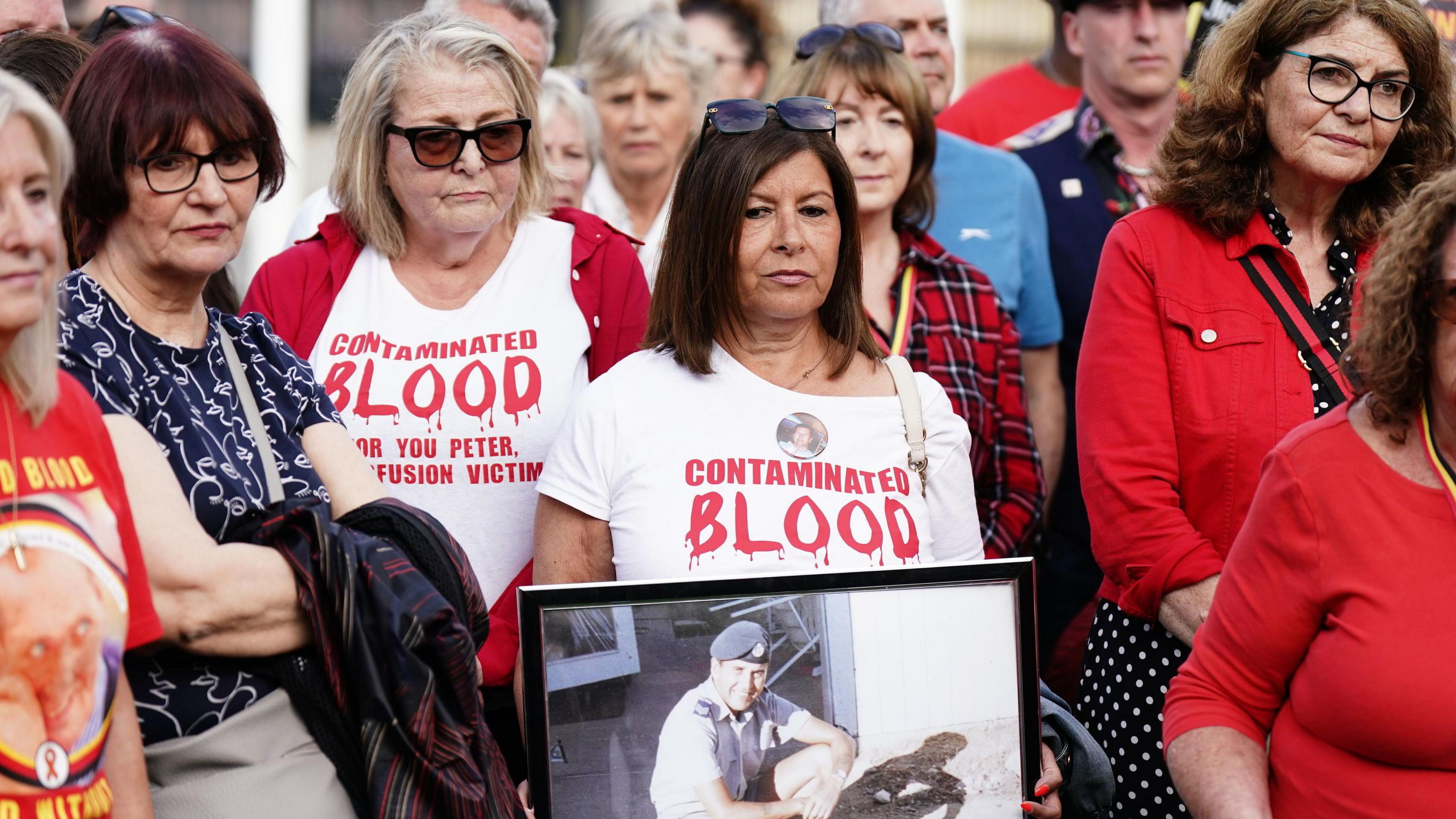 Infected blood campaigners meeting in Parliament Square in London ahead of the publication of the final report into the scandal in 2024