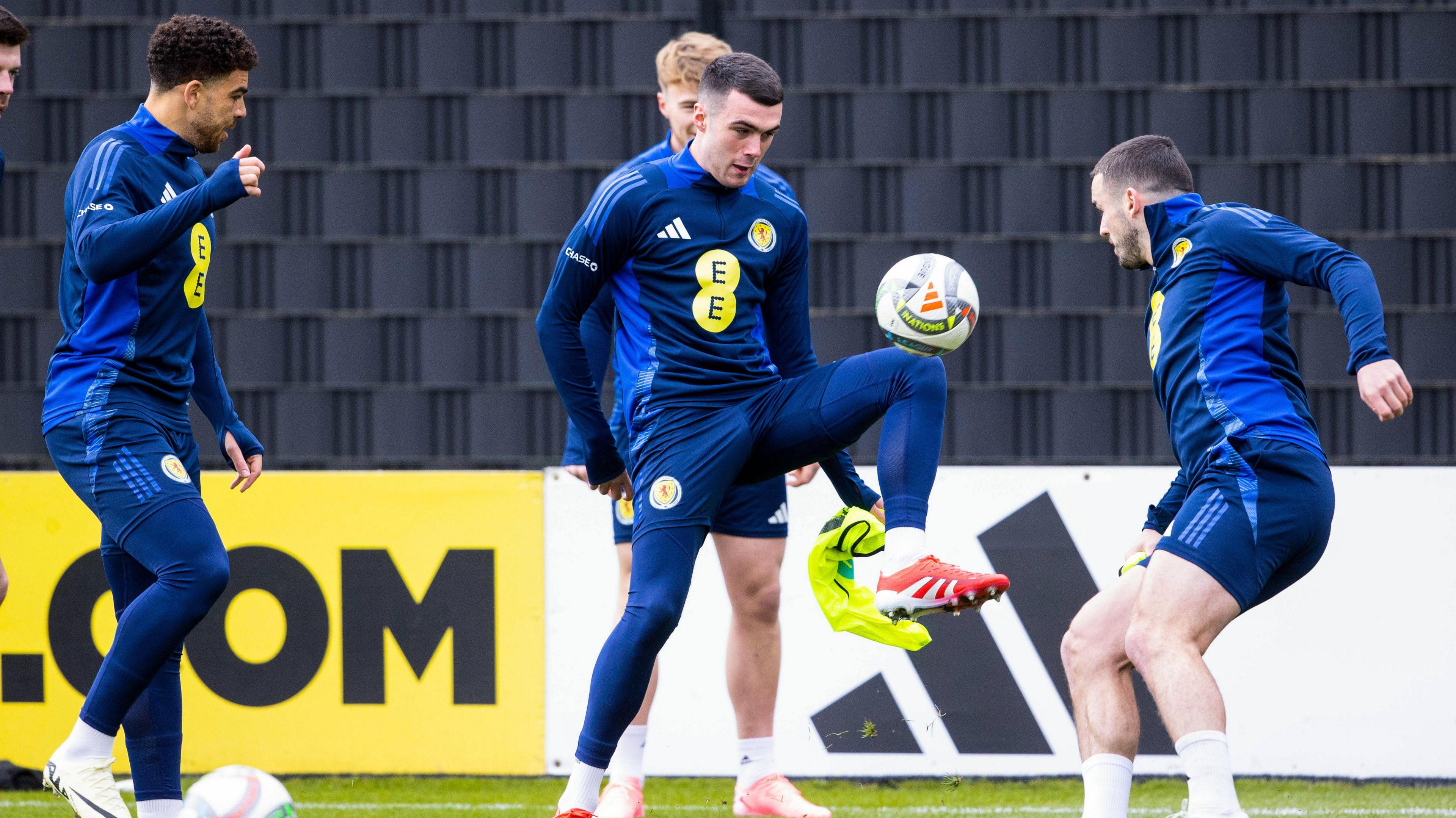 Lennon Miller (centre) during a Scotland training session