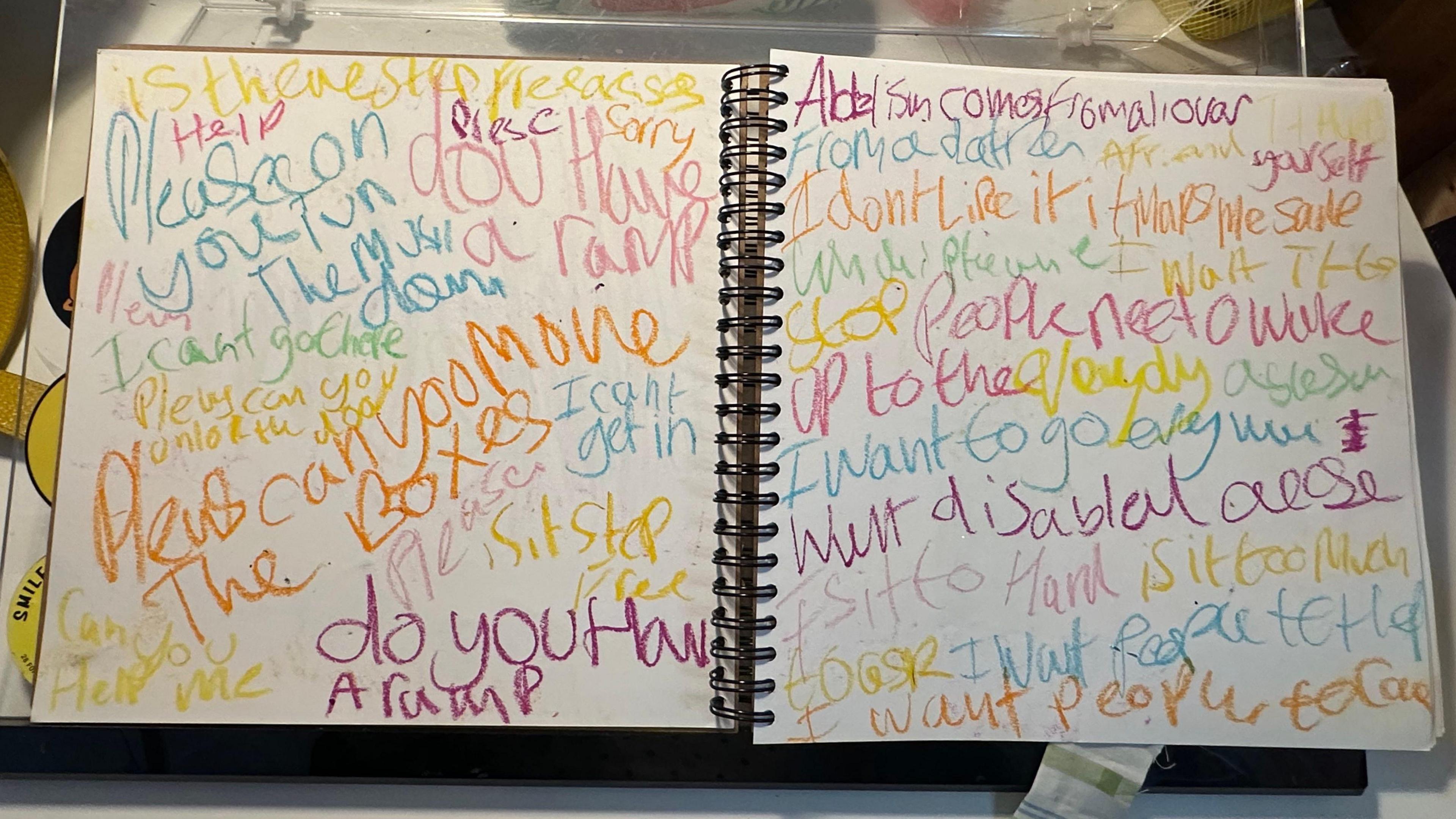 Sketchbook filled with multi-colour writing of phrases she has heard