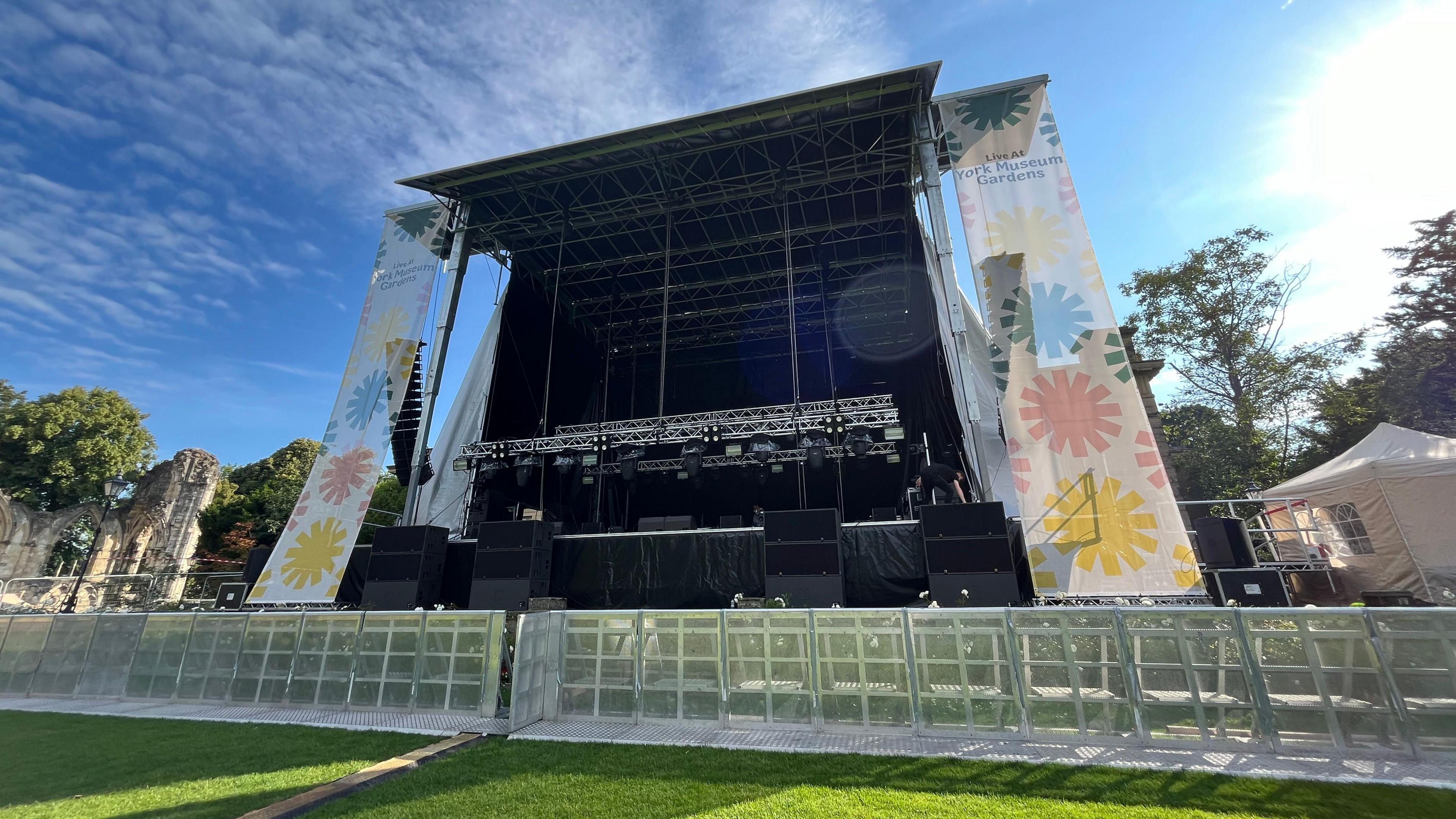 The stage at York Museum Gardens with crowd control barriers