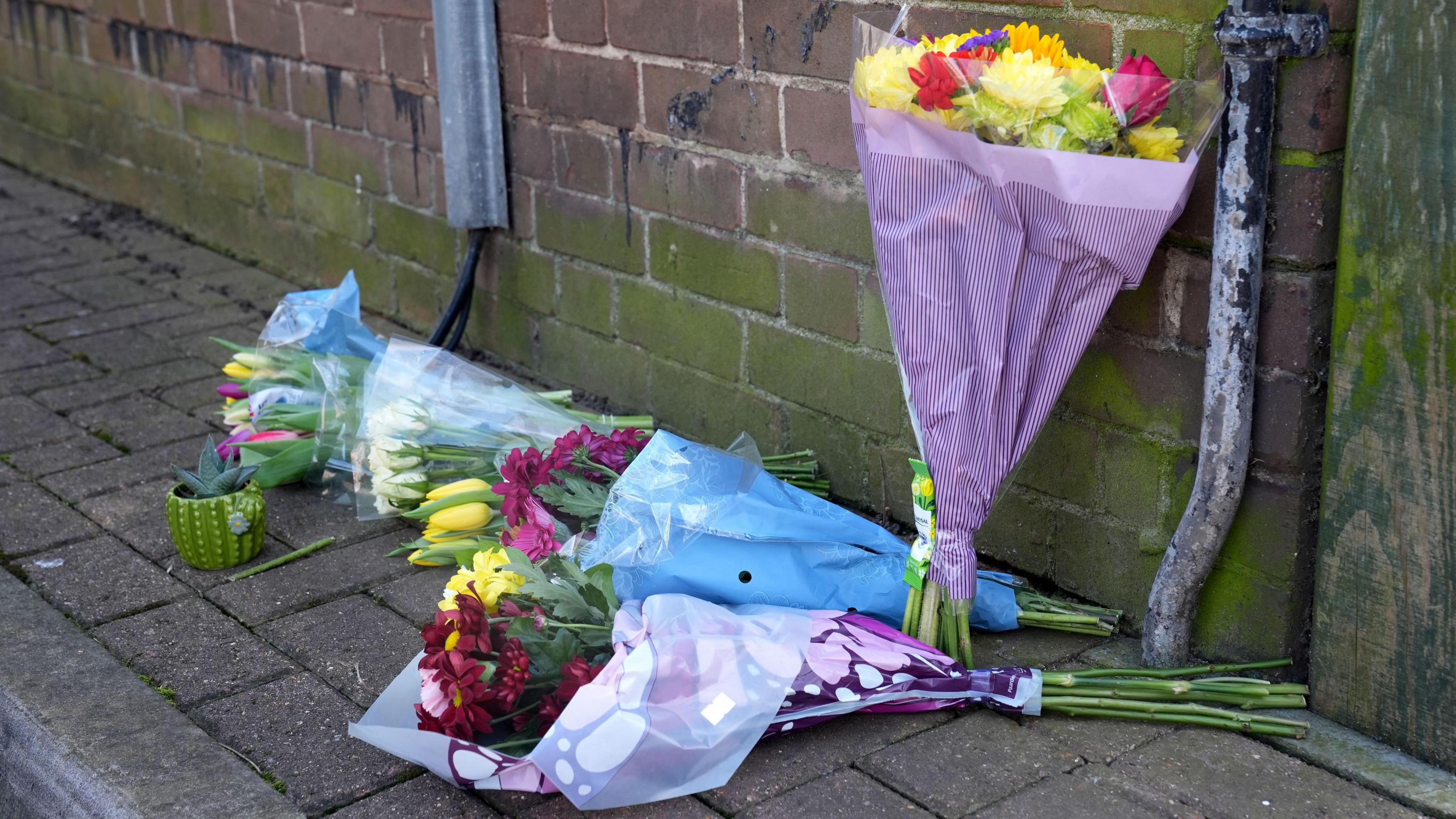 Floral tributes near the scene in Paradise Road.