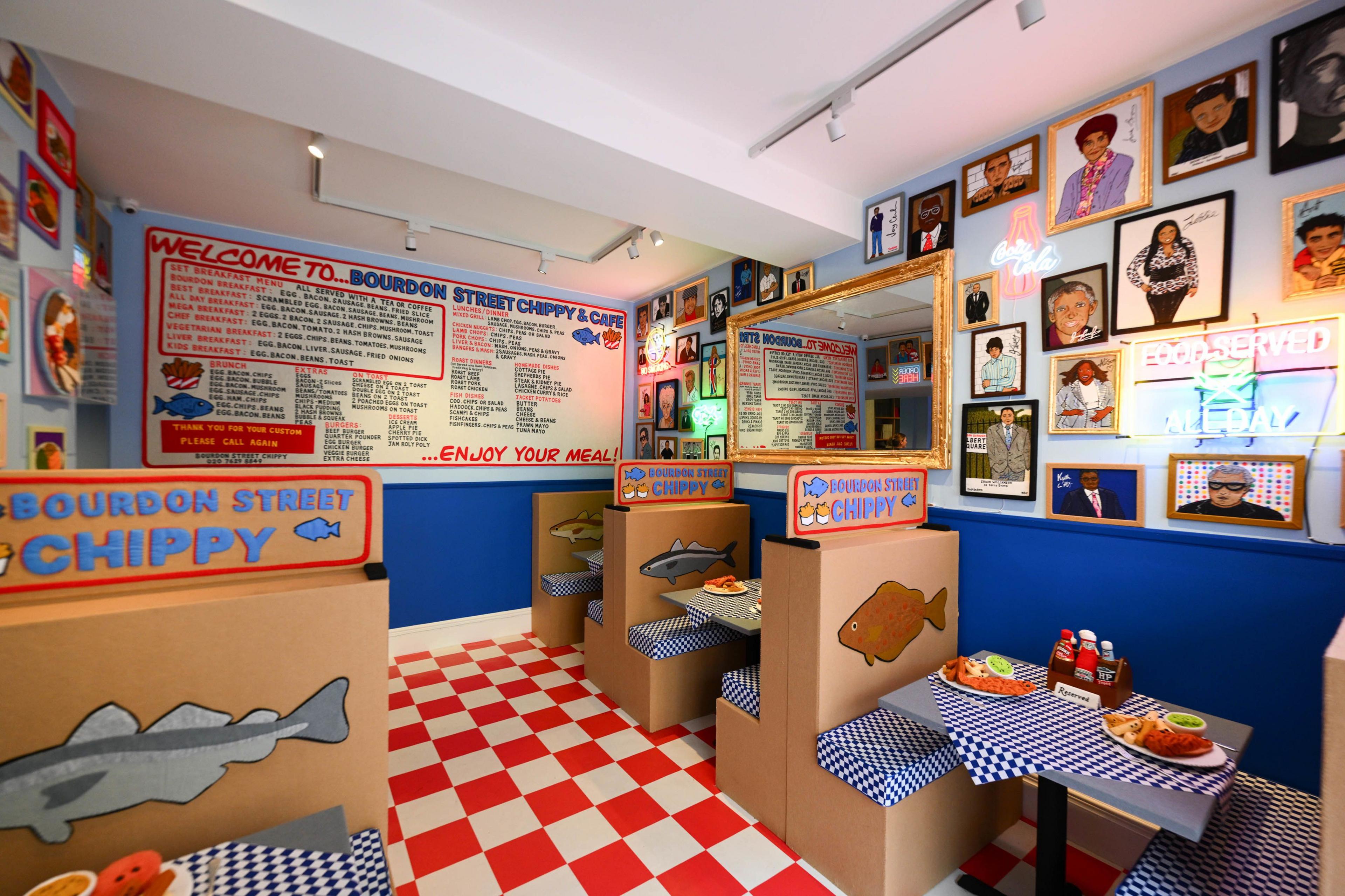 Image of fish and chip shop, with felt tables and chairs.