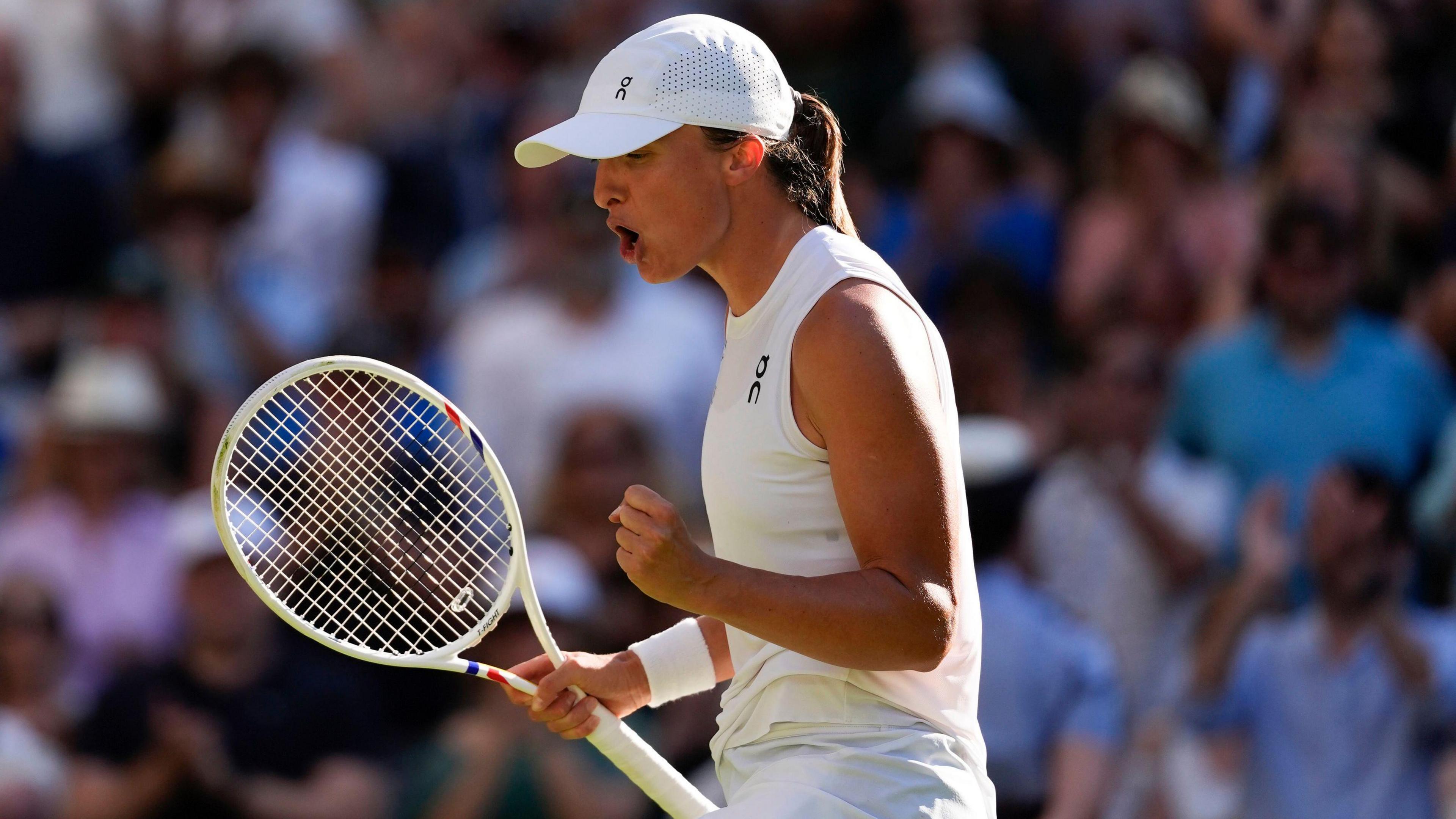 Iga Swiatek celebrates winning a point against Belinda Bencic