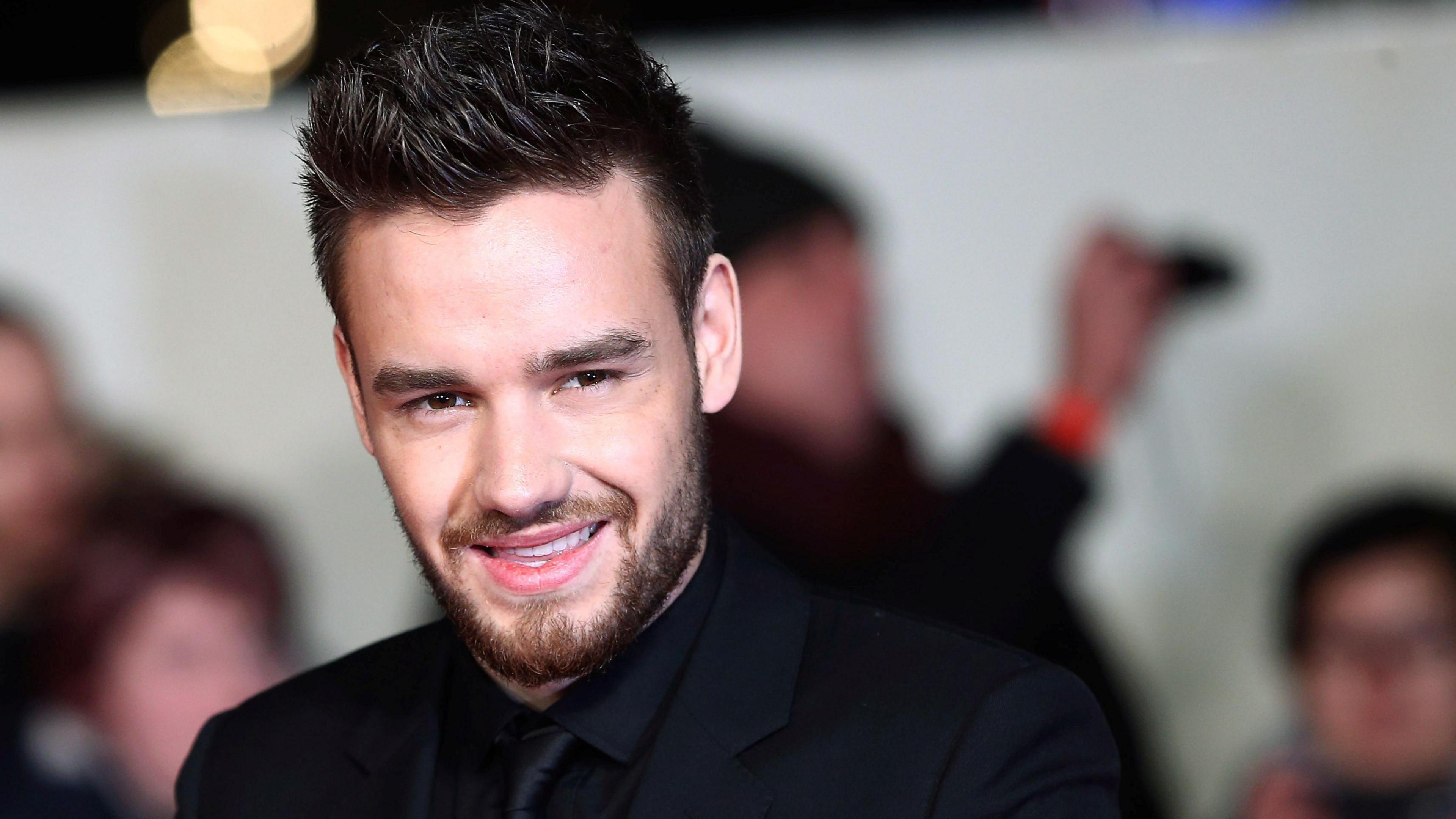 Pop star Liam Payne pictured wearing a black suit. 