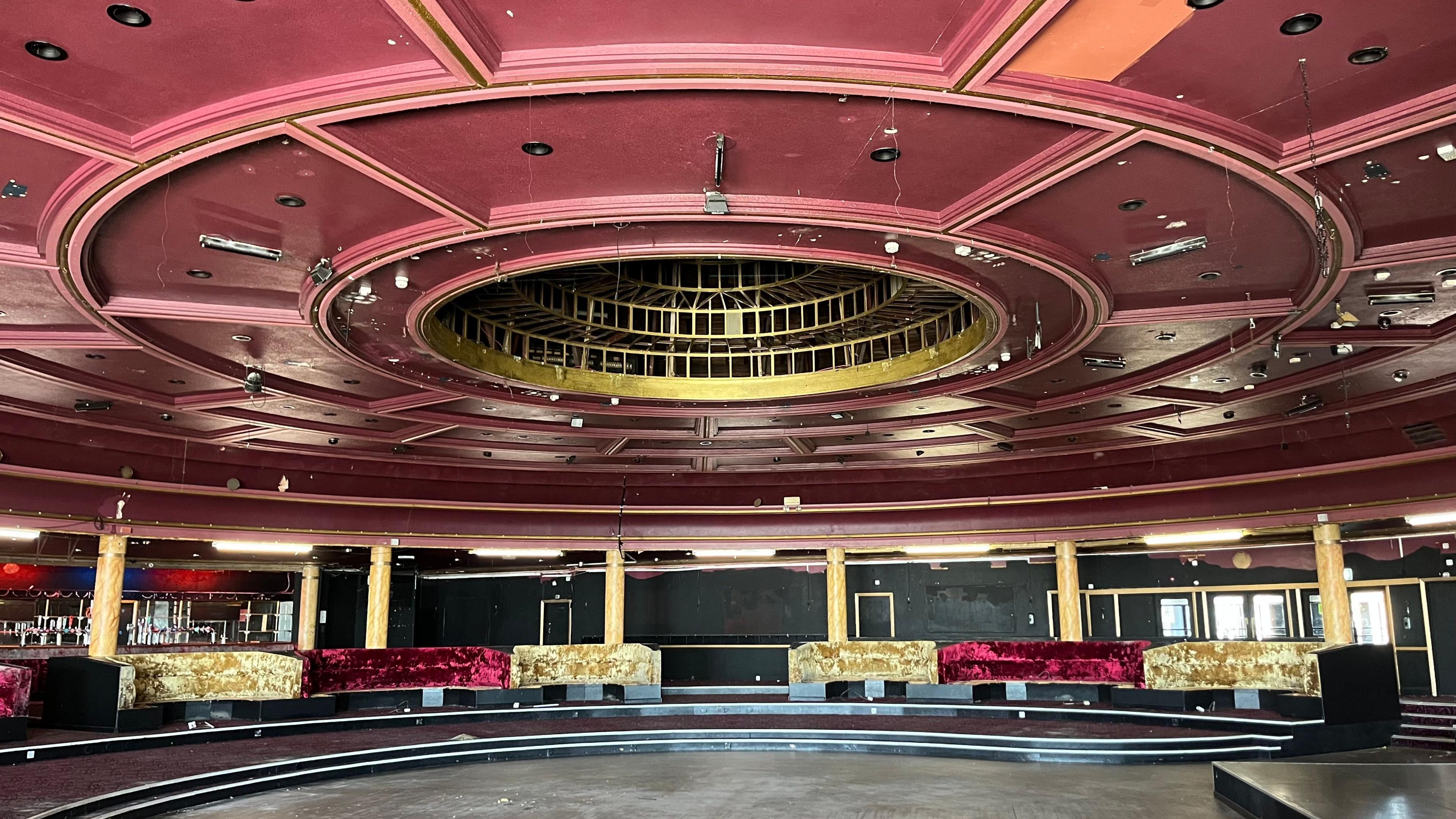 The inside of the building at the Ocean Room dance venue in Gorleston. The building is round and there are gold and red velvet crushed sofa's. 