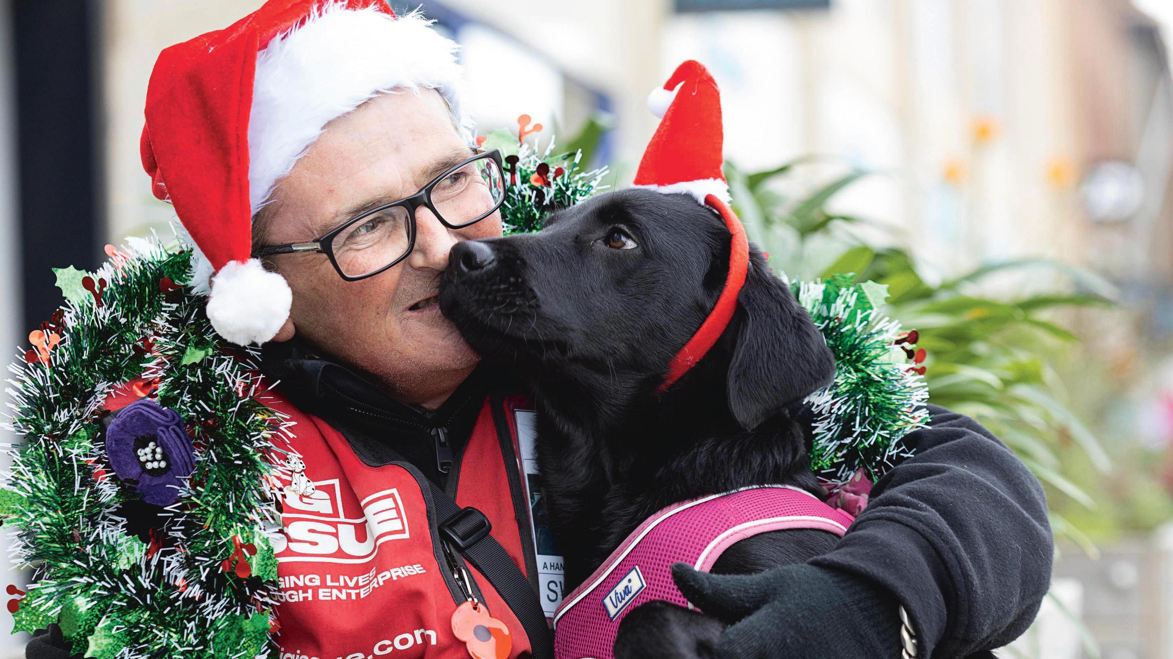 Big Issue seller and dog