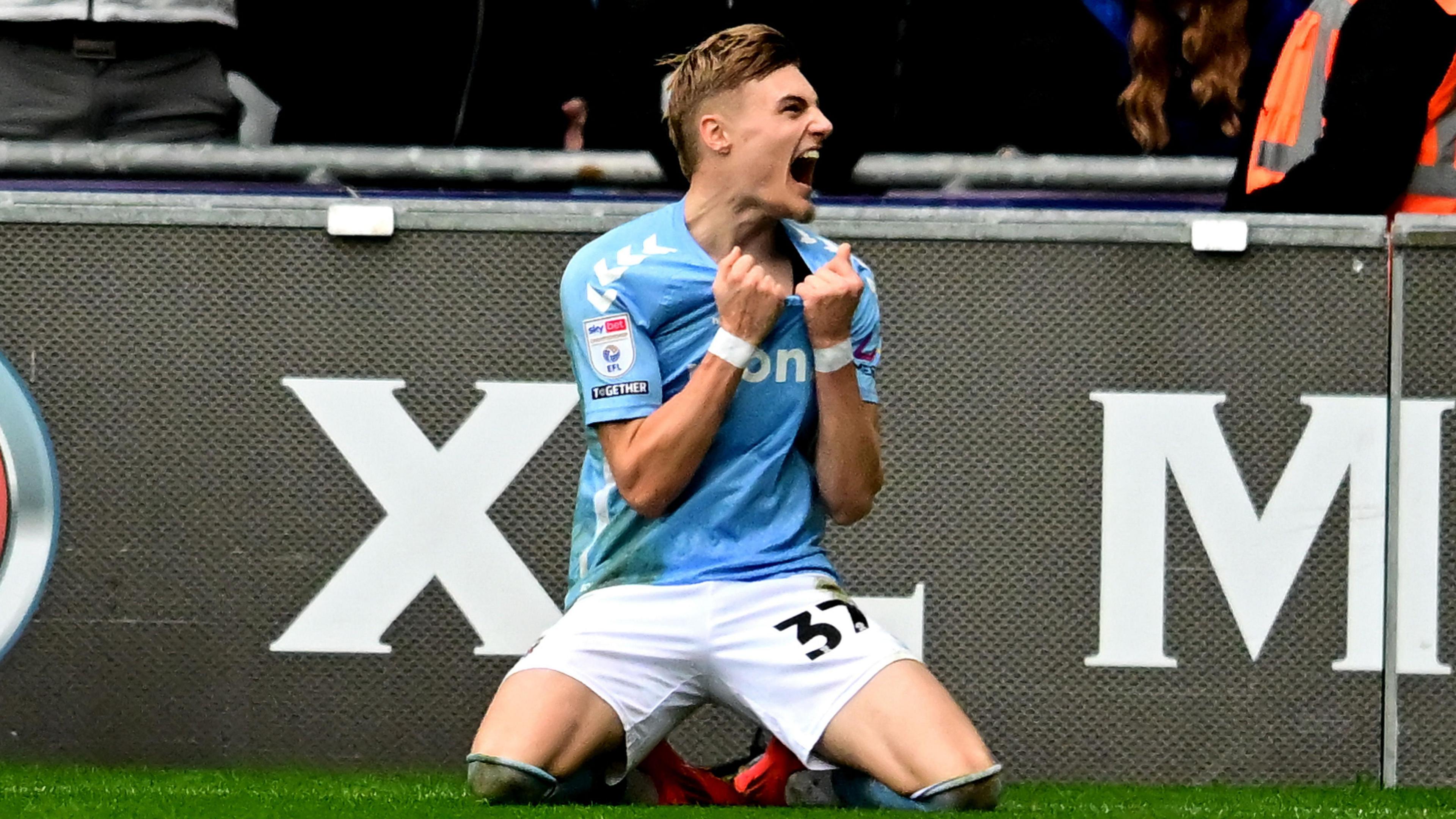 Coventry forward Norman Bassette celebrates scoring