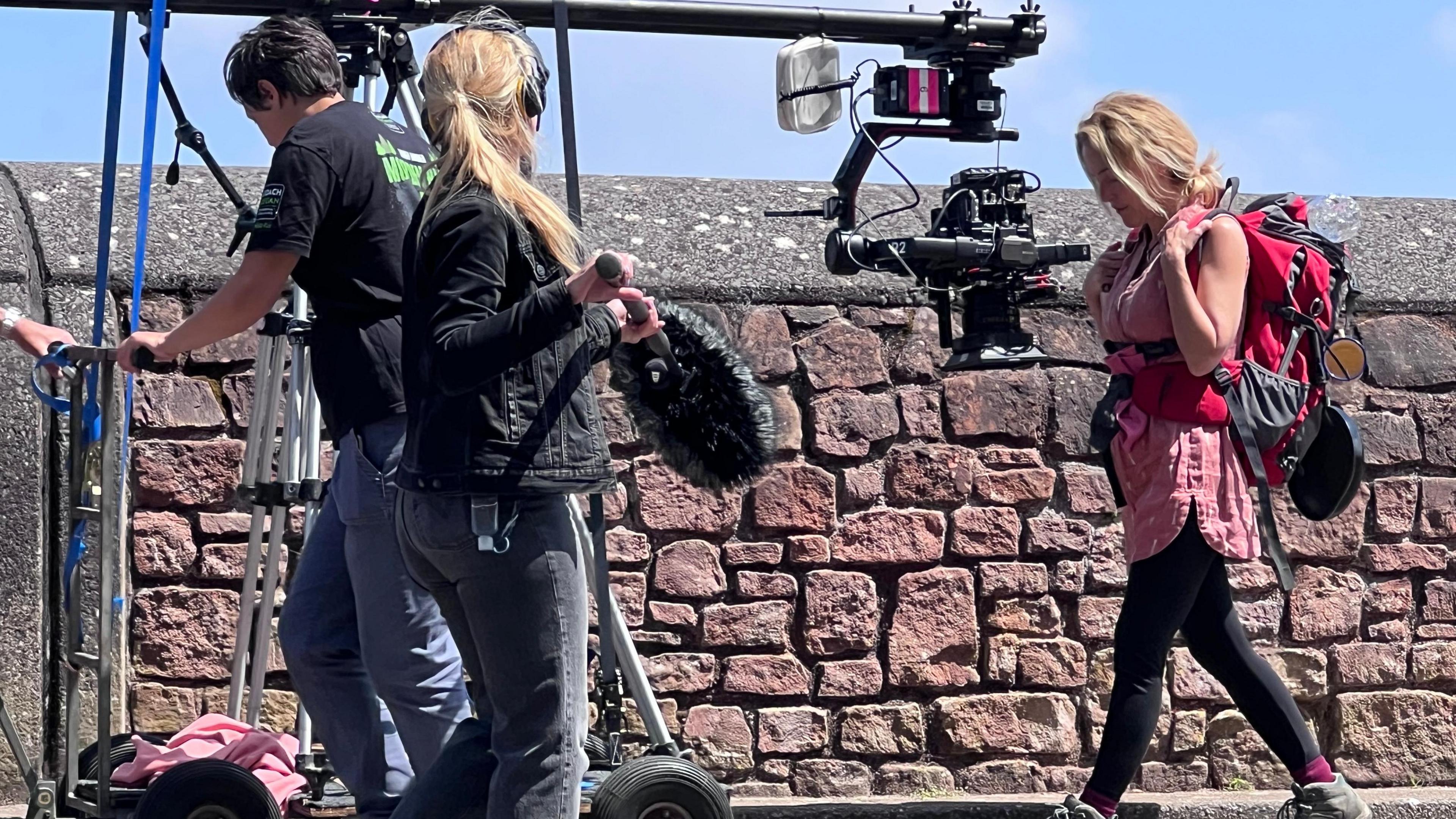 Gillian Anderson on Minehead seafront during filming of The Salt Path