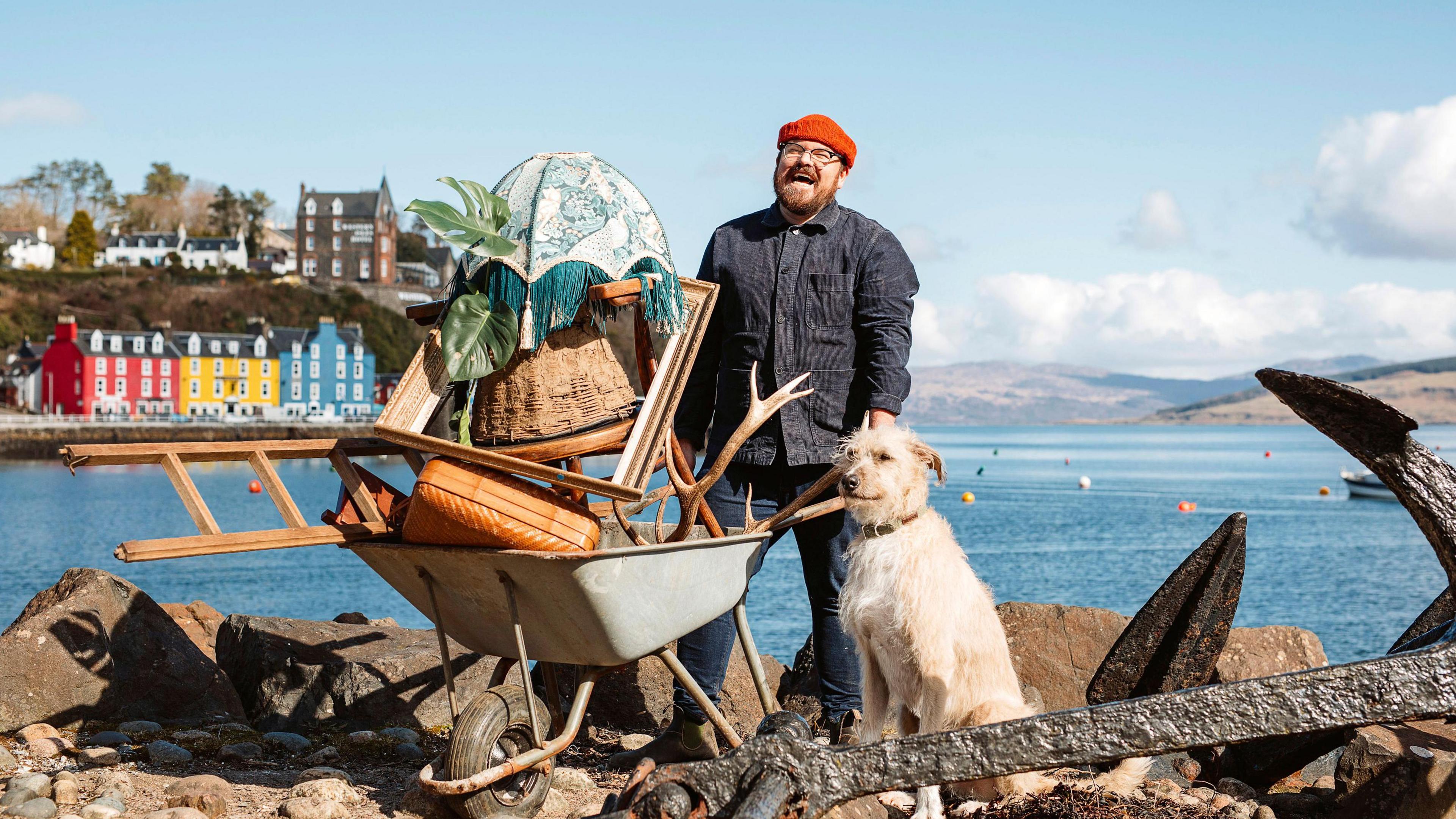 Banjo and Grampa the dog with a wheelbarrow-load of treasures on Mull