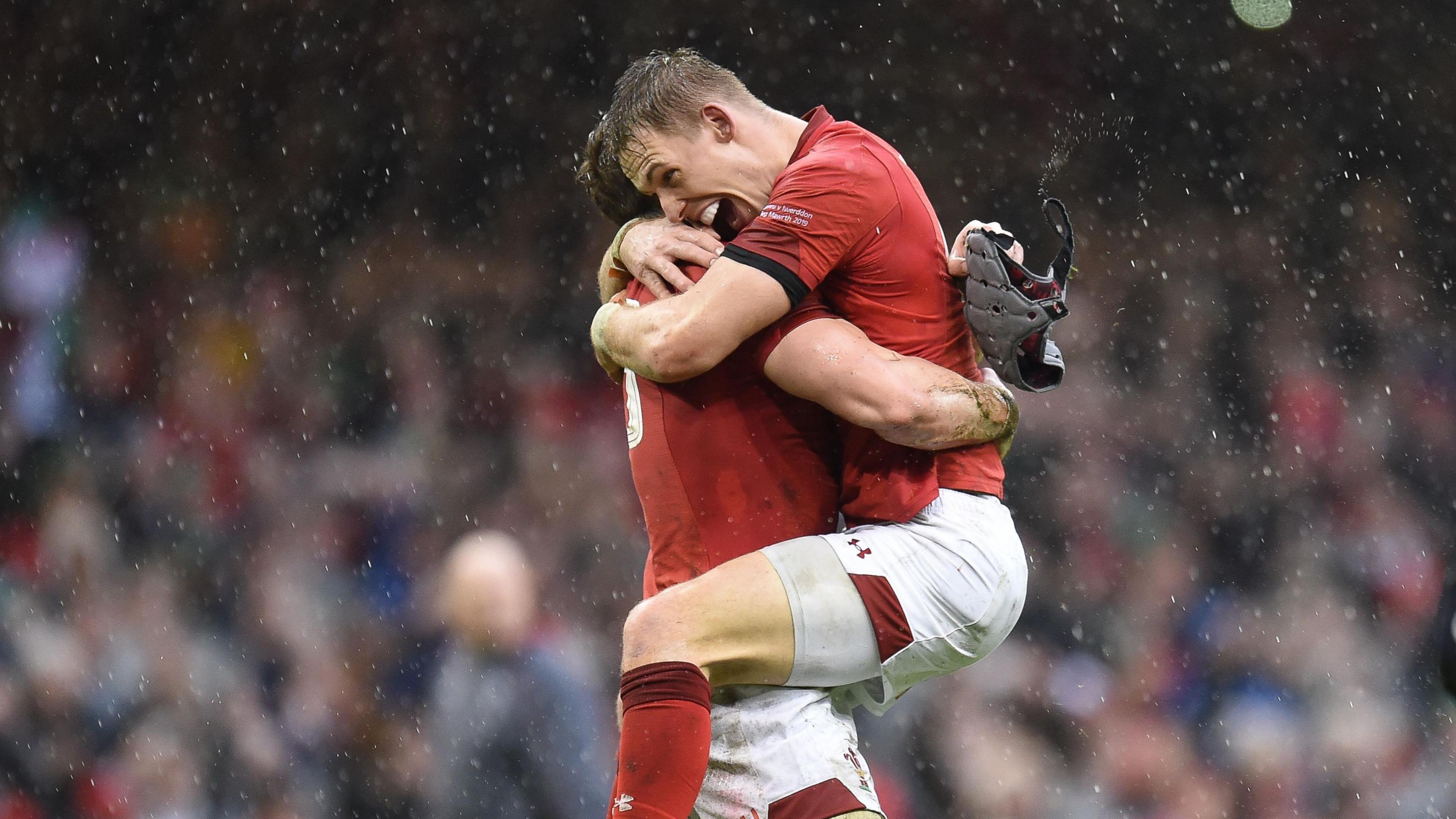 Wales players Liam Williams and Jonathan Davies celebrate winning the Guinness Six Nations and the Grand Slam