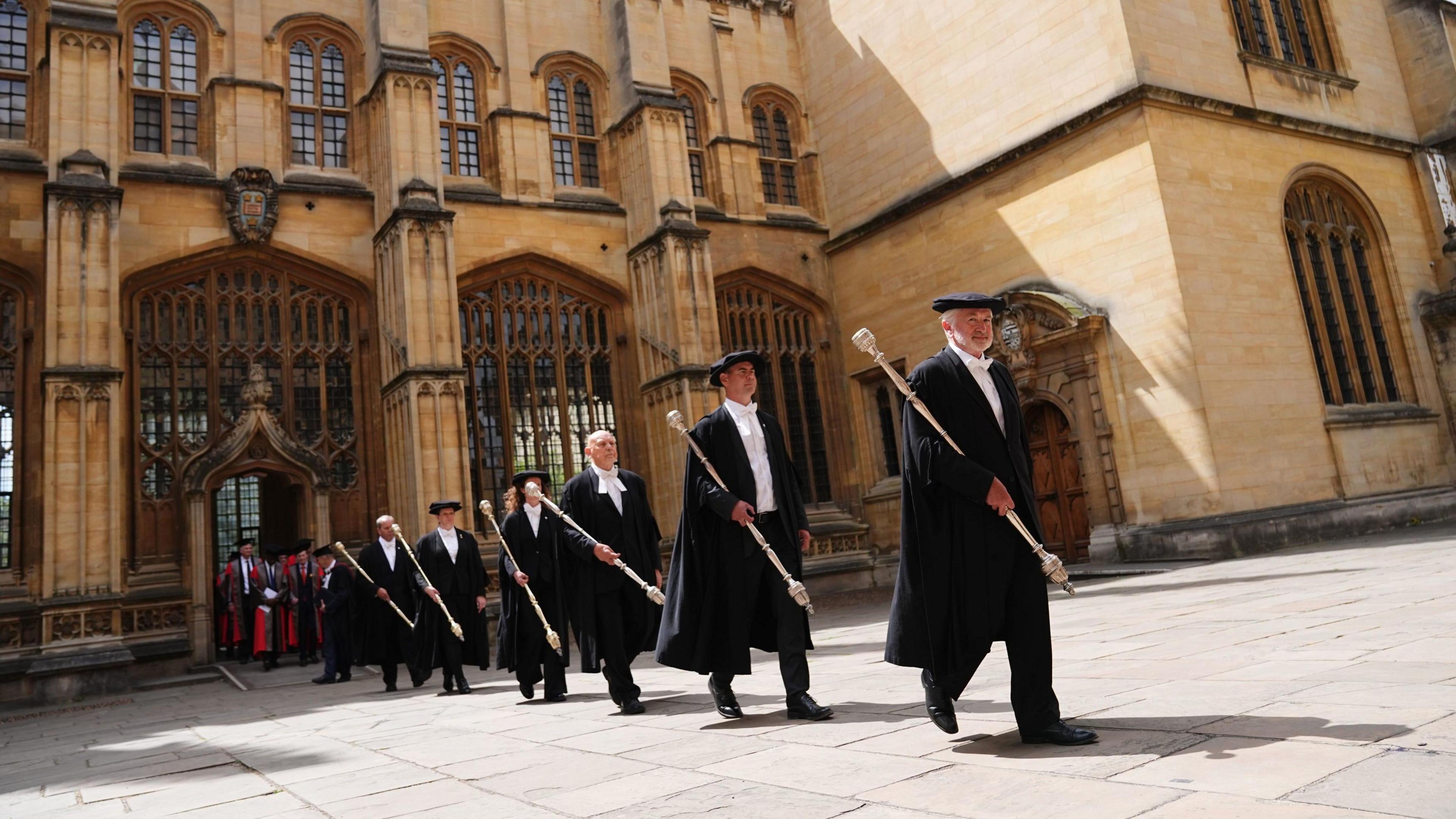 Bedels lead a procession towards the Sheldonian Theatre, ahead of Oxford University's annual Encaenia Ceremony where award honorary degrees will awarded. 