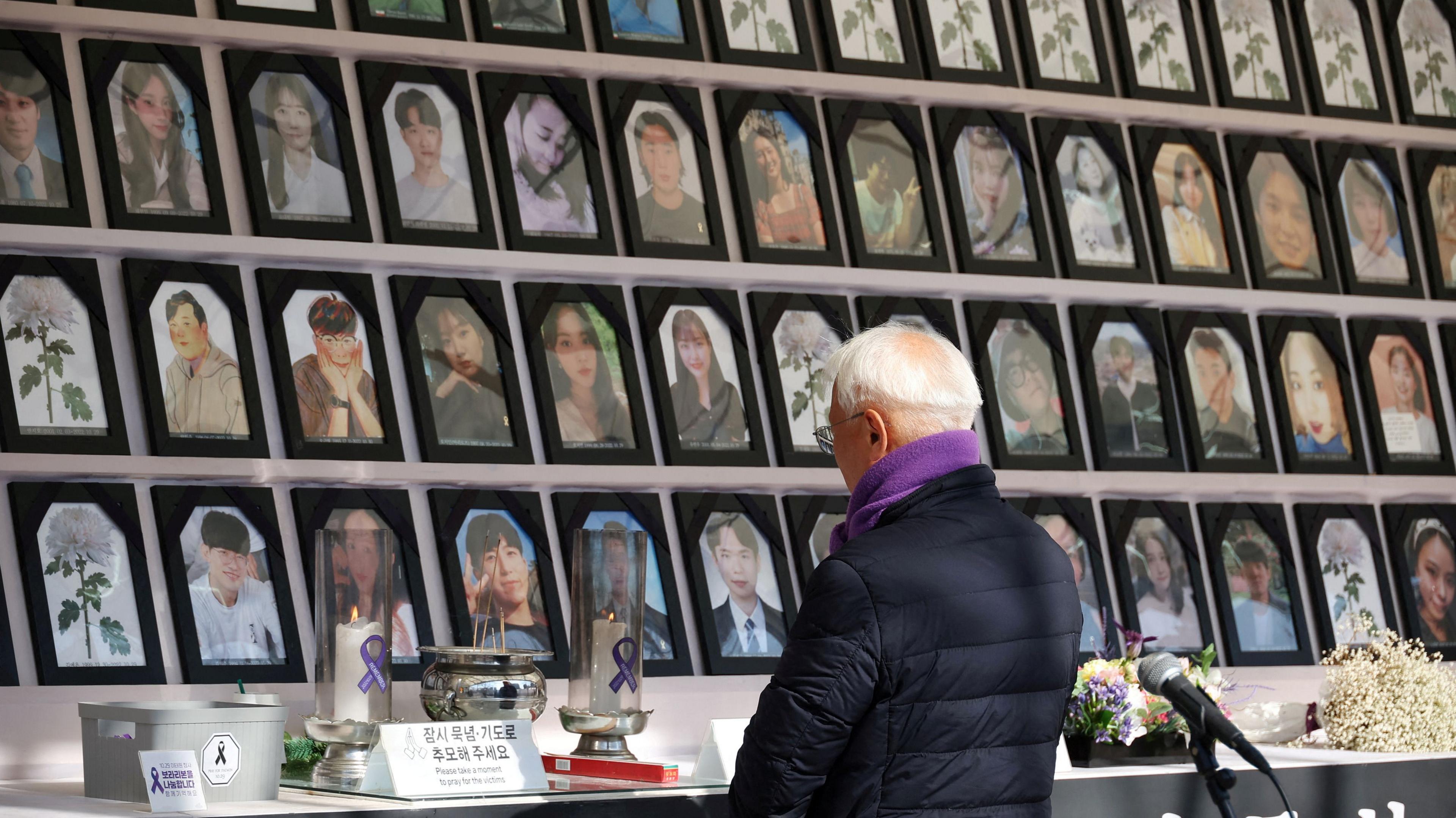 A man mourns at the memorial altar for victims before a press conference against the government’s decision to veto a special bill for the Itaewon disaster that killed over 150 people in the party district of Itaewon, in Seoul, South Korea, January 30, 2024. 