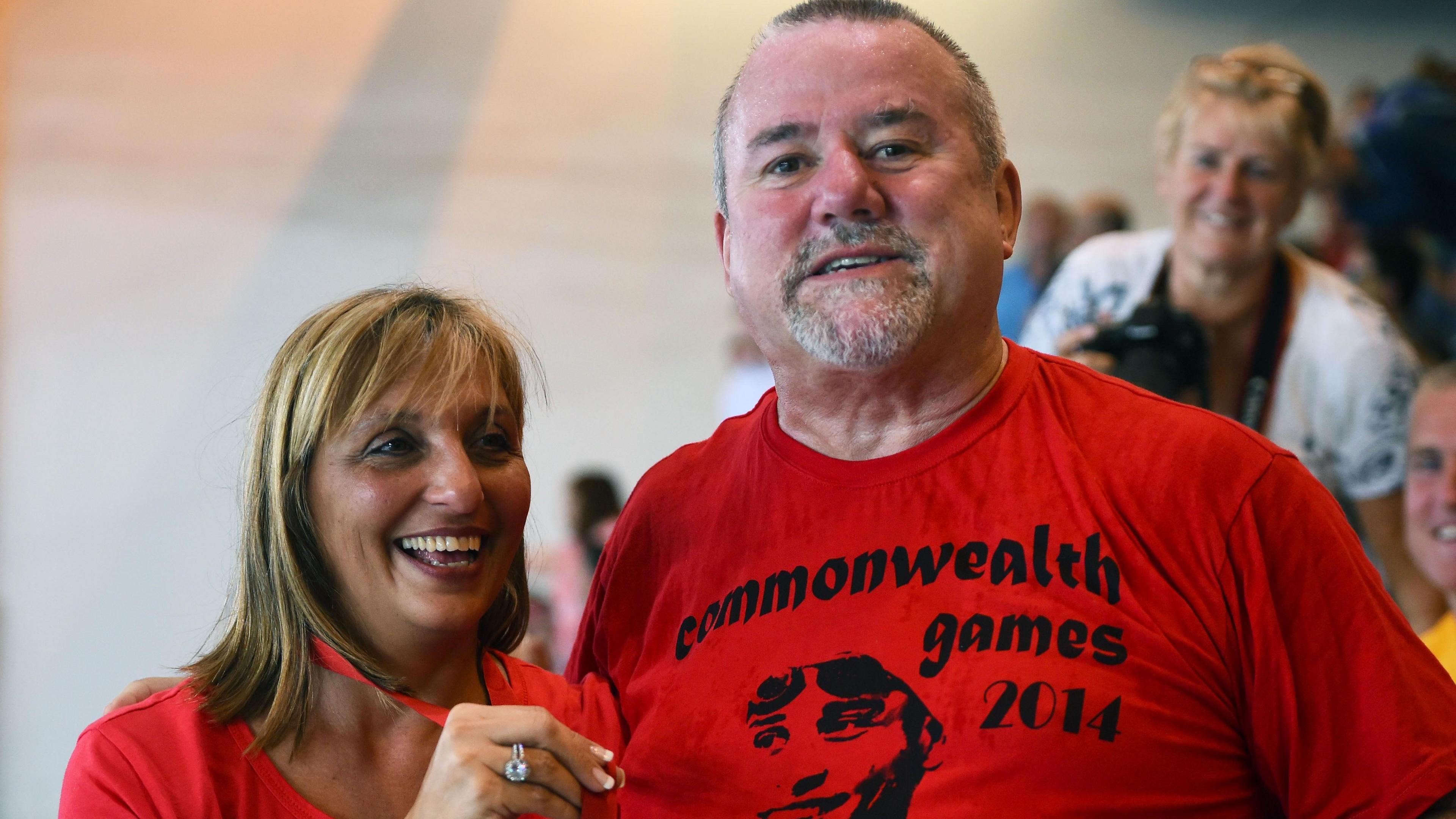 Bert and wife Geraldine - who are both wearing red t-shirts - travelled to Scotland to cheer on Chad at the 2014 Commonwealth Games.