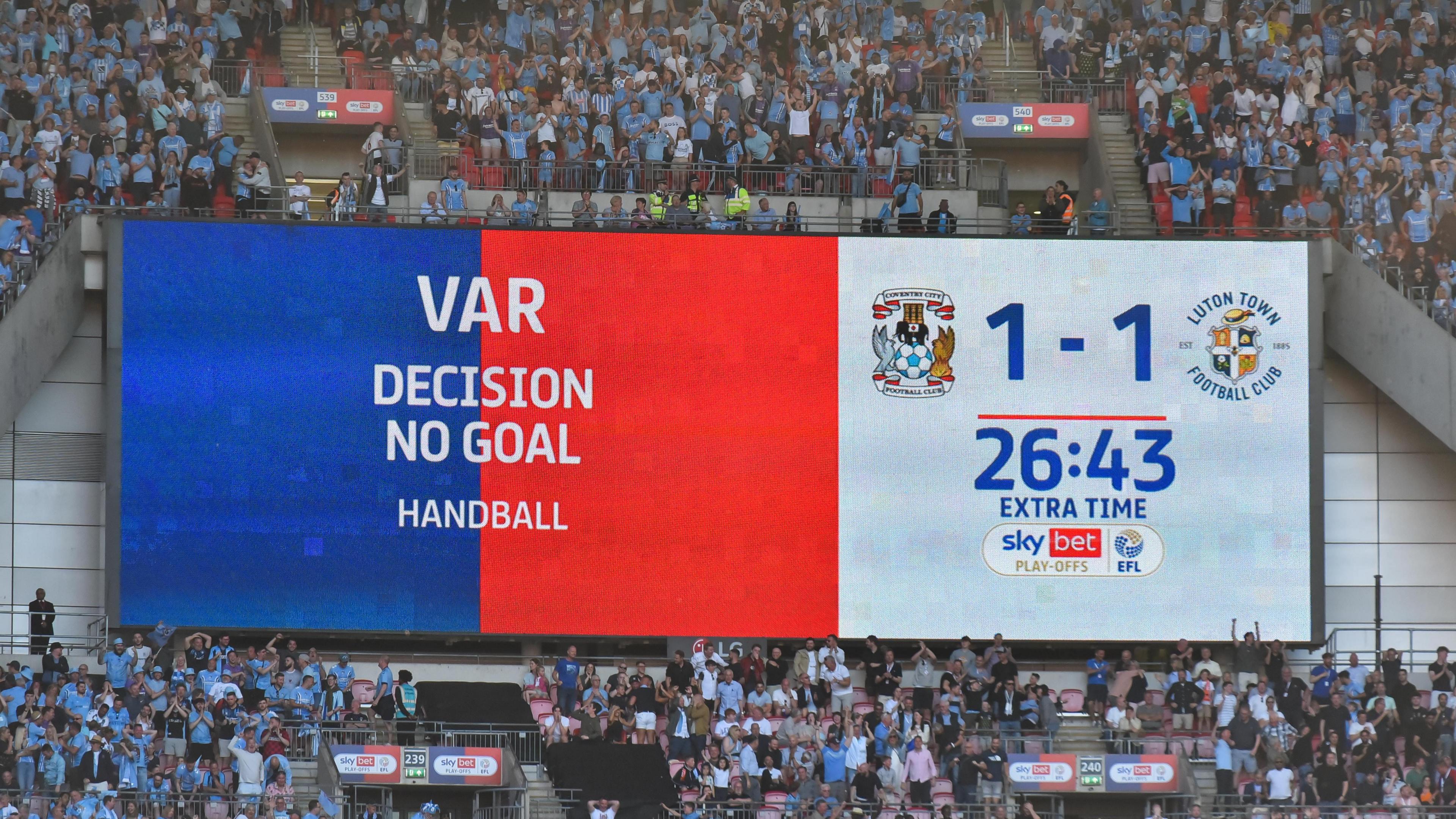 The big screen at Wembley showing 'VAR decision no goal, handball' during the Championship play-off final between Coventry and Luton in 2023
