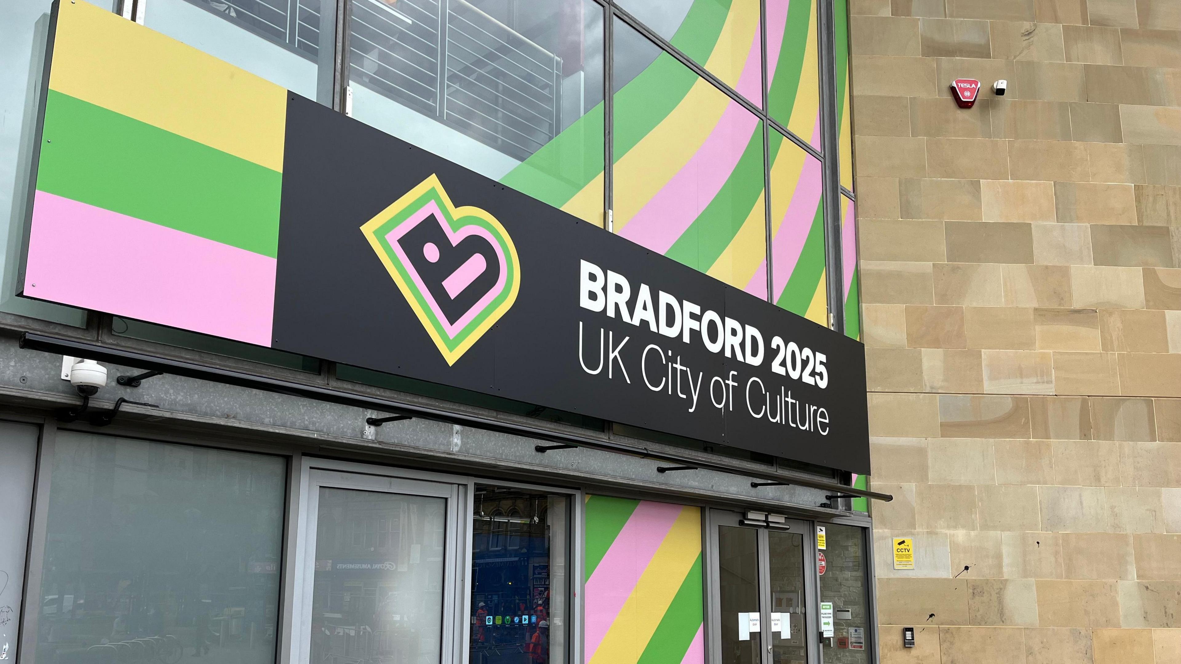 Bradford's City of Culture office, with green, yellow and purple signage