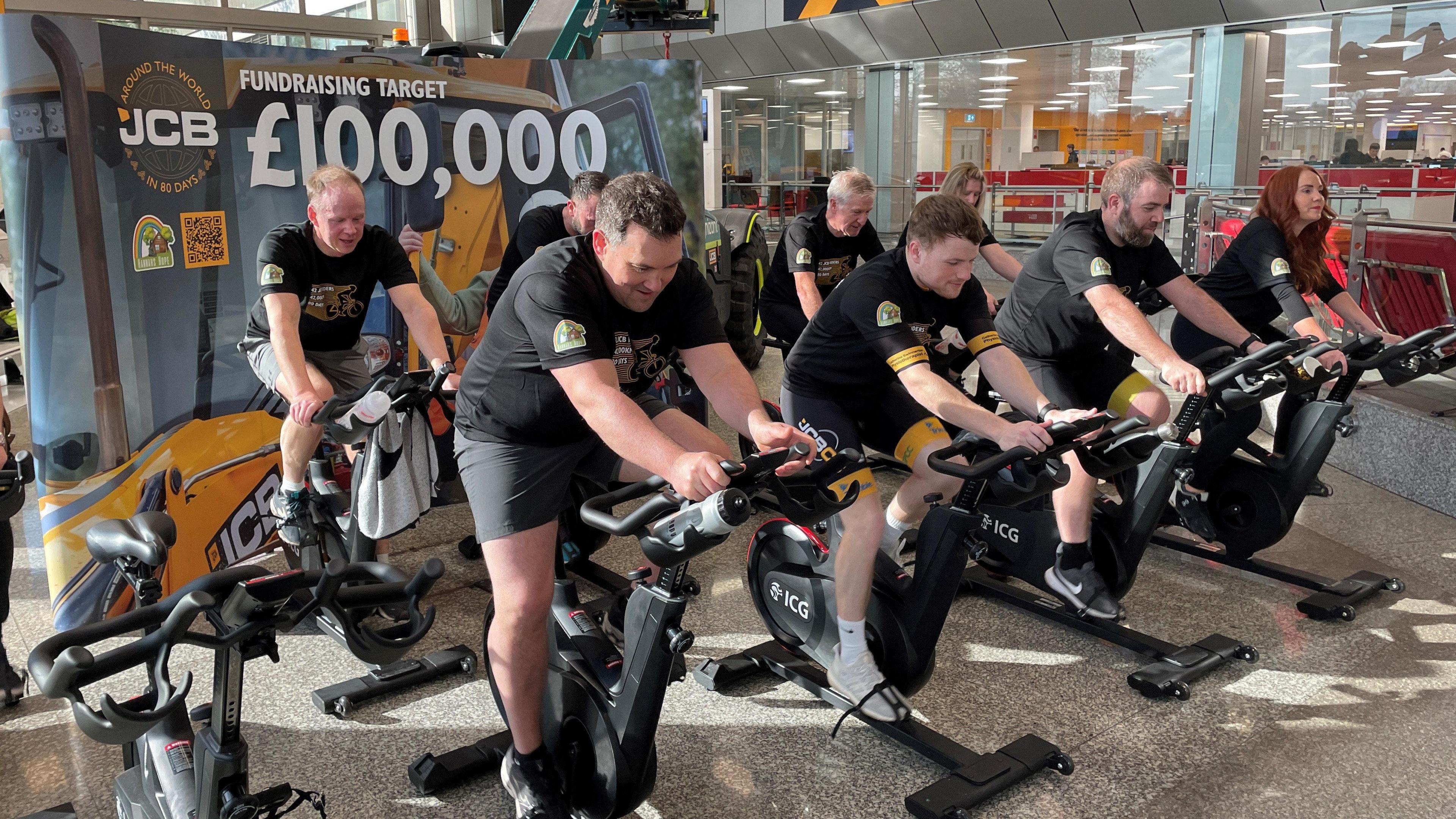 JCB workers cycling