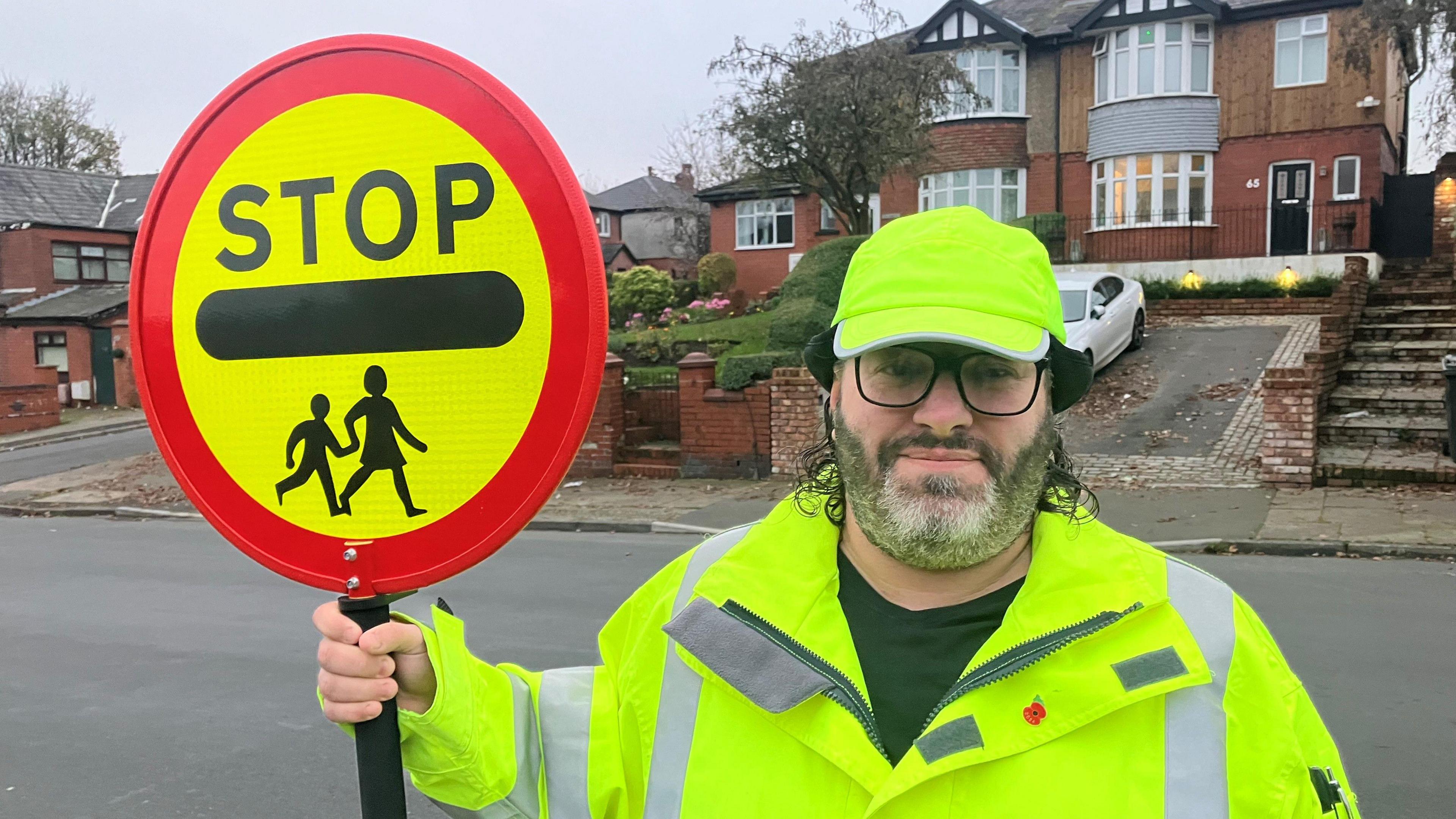 Barry Jones with his lollipop stick on Bury Old Road in Heywood