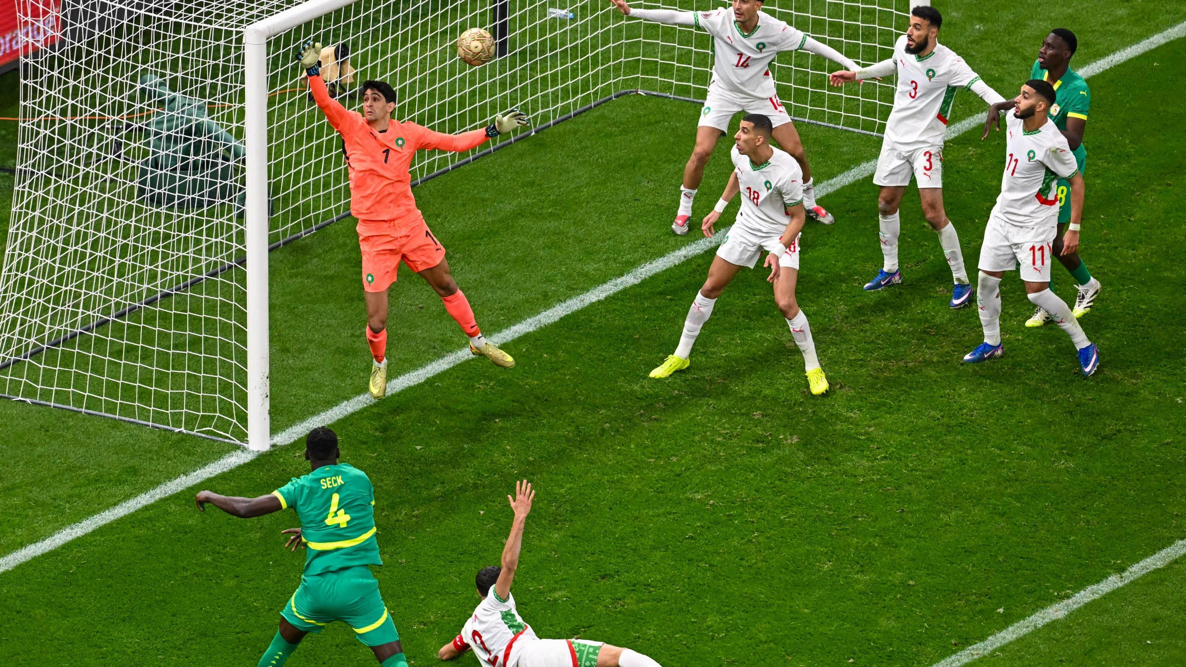 Players from Morocco and Senegal react after Abdoulaye Seck heads against the post during the Africa Cup of Nations final