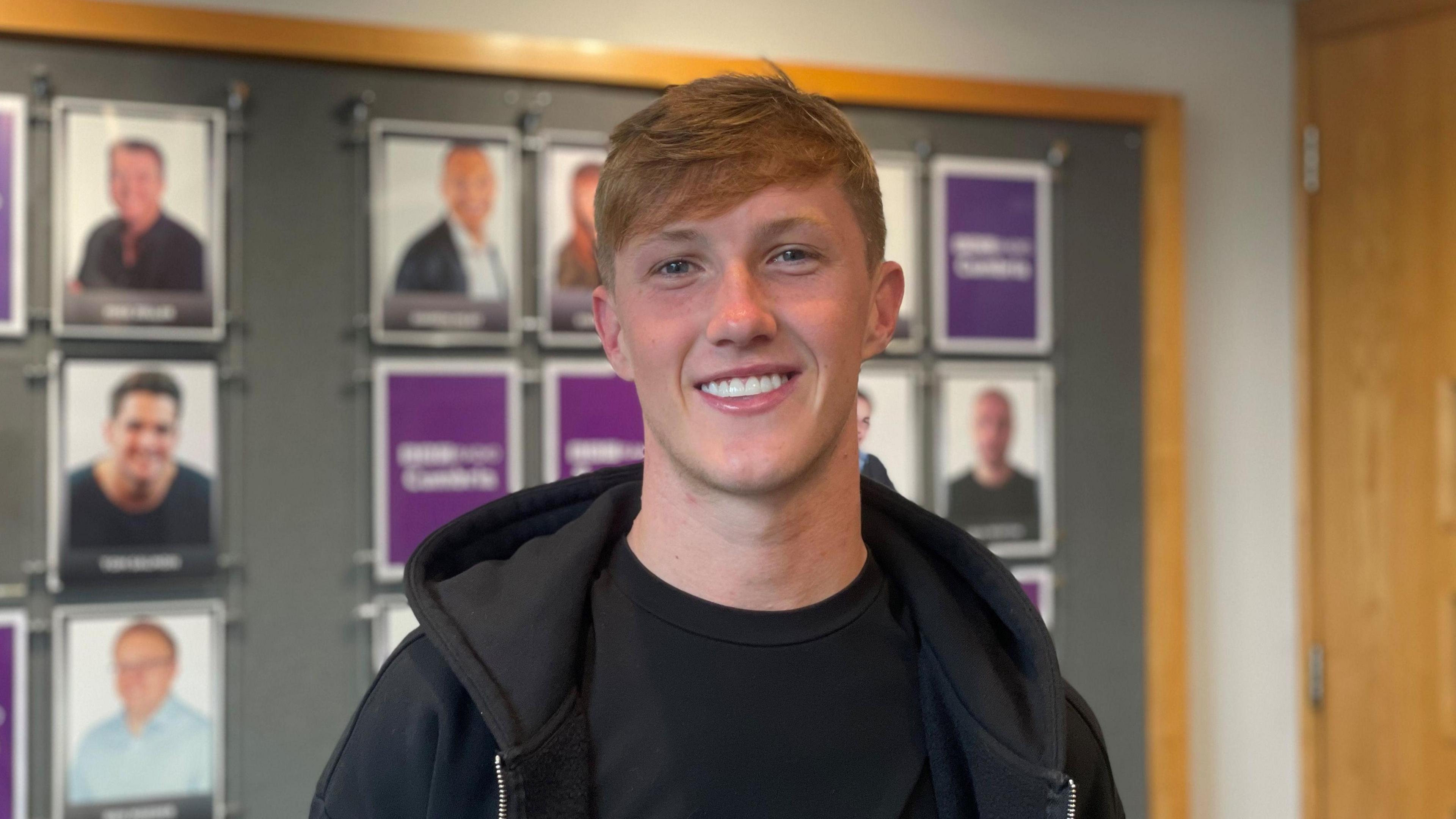 Thomas Atkinson posing for the camera at BBC Radio Cumbria's offices